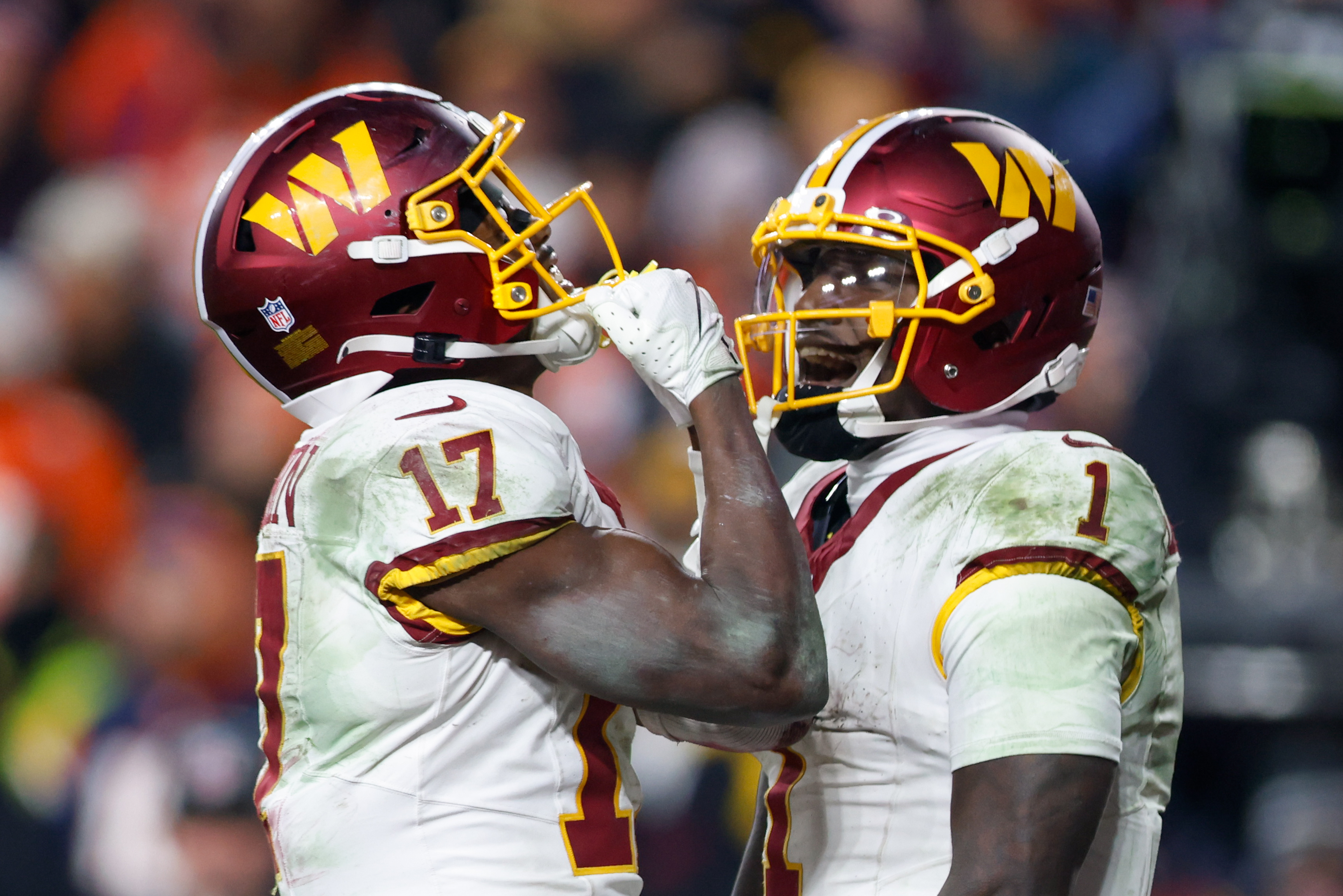 Washington Commanders wide receivers Terry McLaurin (17) and Deebo Samuel (1) celebrate as we offer our Cowboys vs. Commanders player props for Christmas Day.