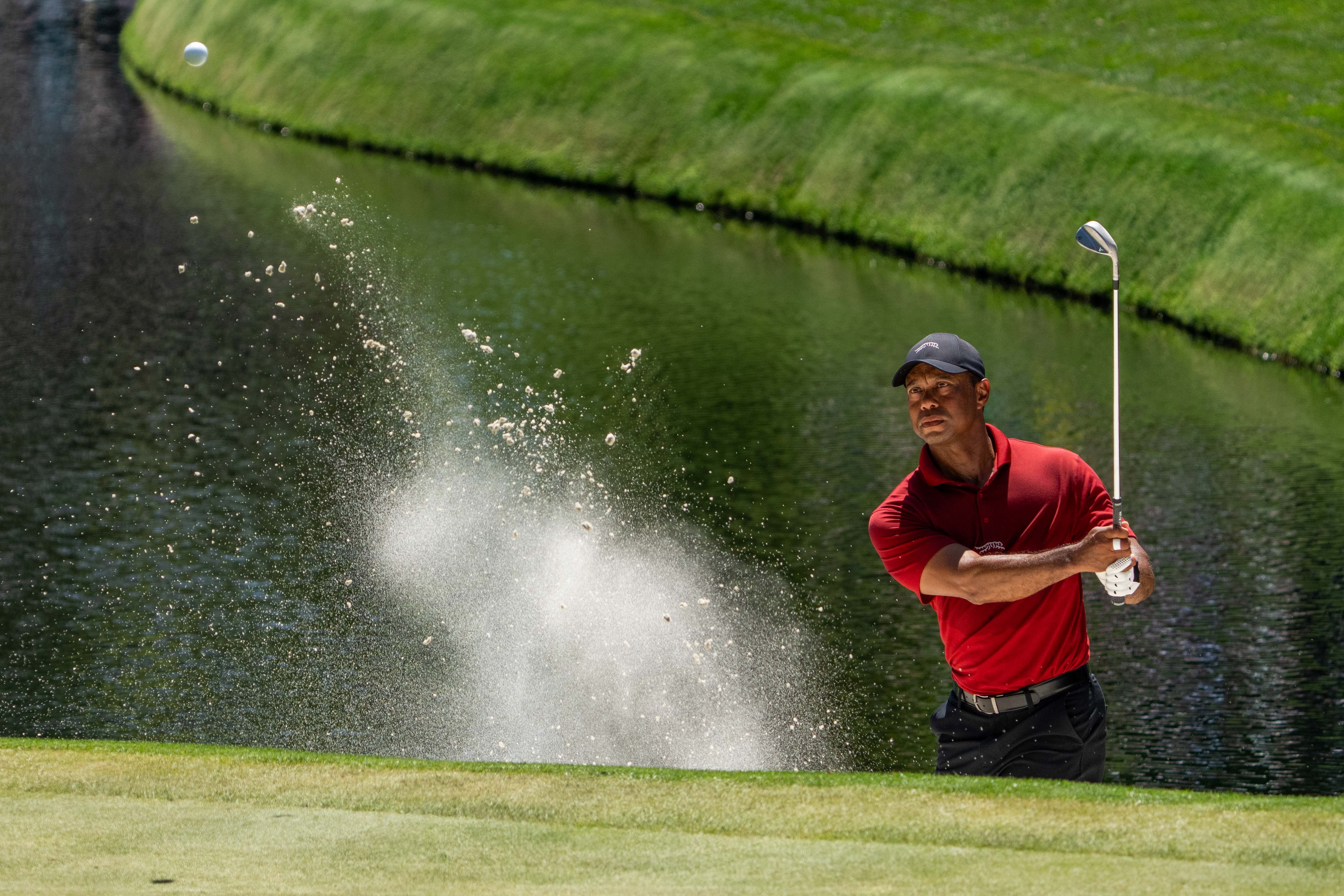 Tiger Woods hits his bunker shot on the 16th hole during the final round of the Masters as we look at Tiger Woods' potential return in the 2026 Masters odds