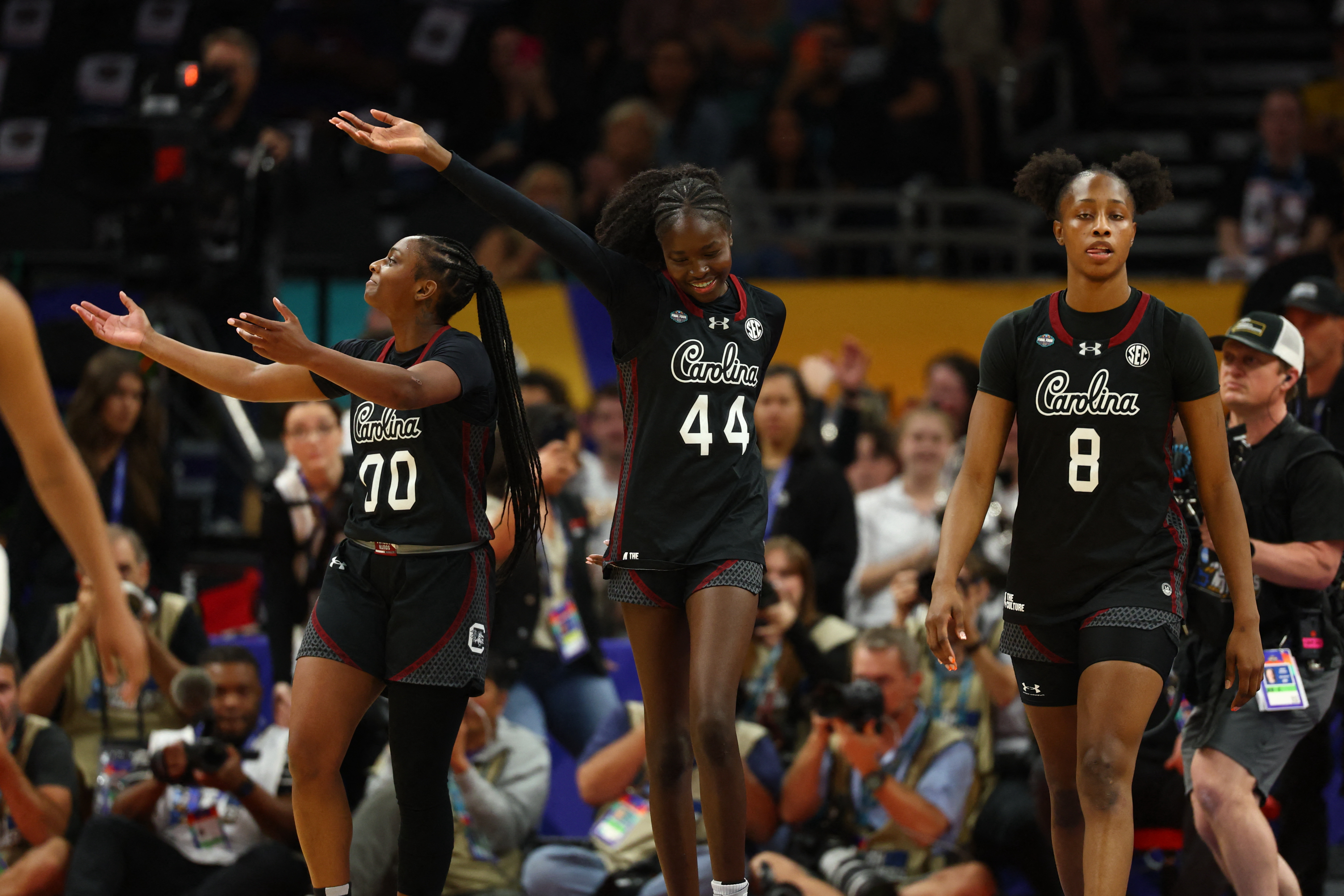 South Carolina Gamecocks forward Joyce Edwards (8), guard Agot Makeer (44) and South Carolina Gamecocks guard Ta'niya Latson (00) react as we break down our South Carolina vs. UCLA prediction & picks.