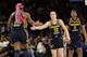 Caitlin Clark (22) and Aliyah Boston (7) of the Indiana Fever celebrate as we offer our best Fever vs. Sun predictions and expert picks for Tuesday's season opener at Mohegan Sun Arena in Uncasville, Conn.