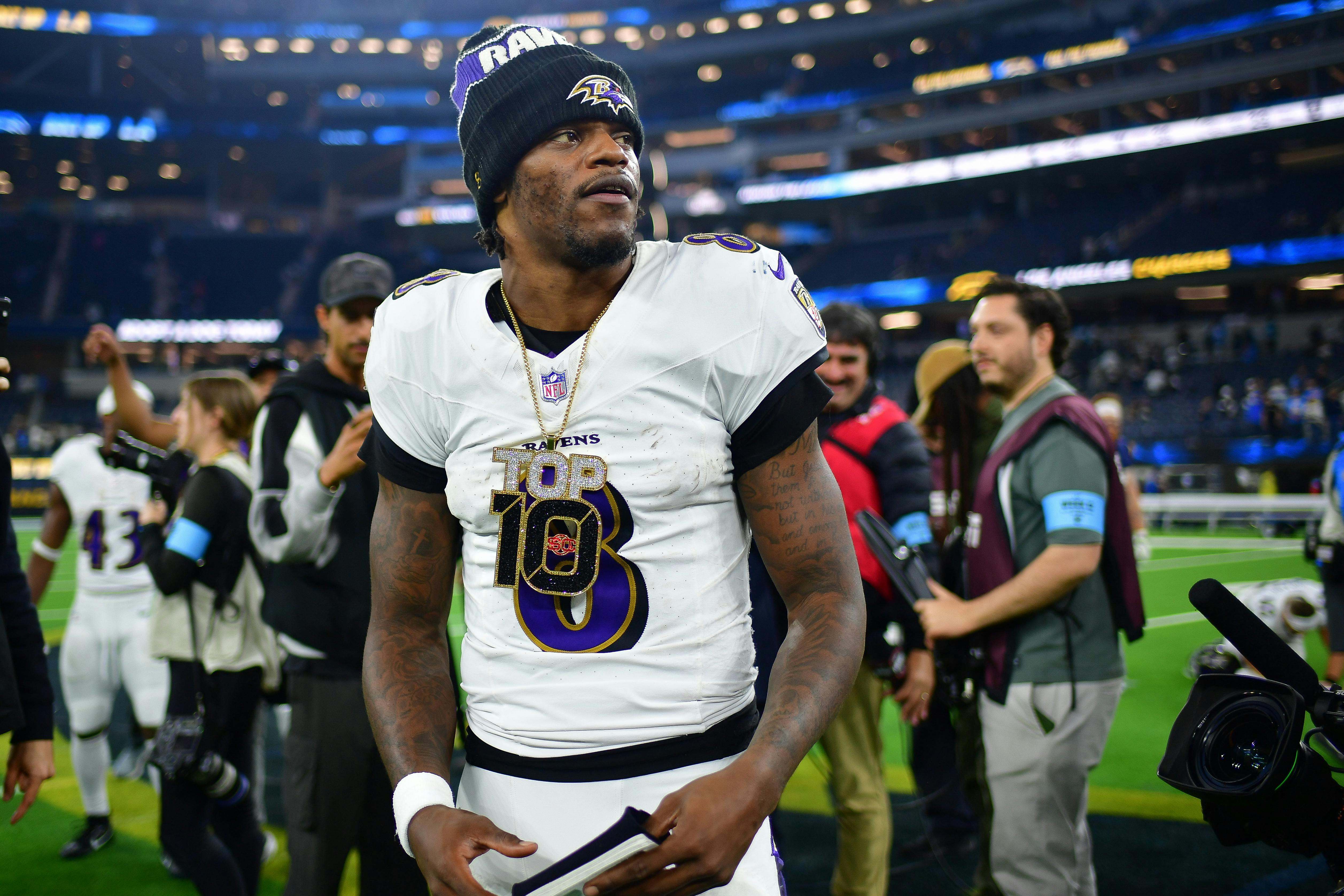 Baltimore Ravens quarterback Lamar Jackson reacts as we offer our NFL playoff bracket predictions with picks and projected scores for every game.