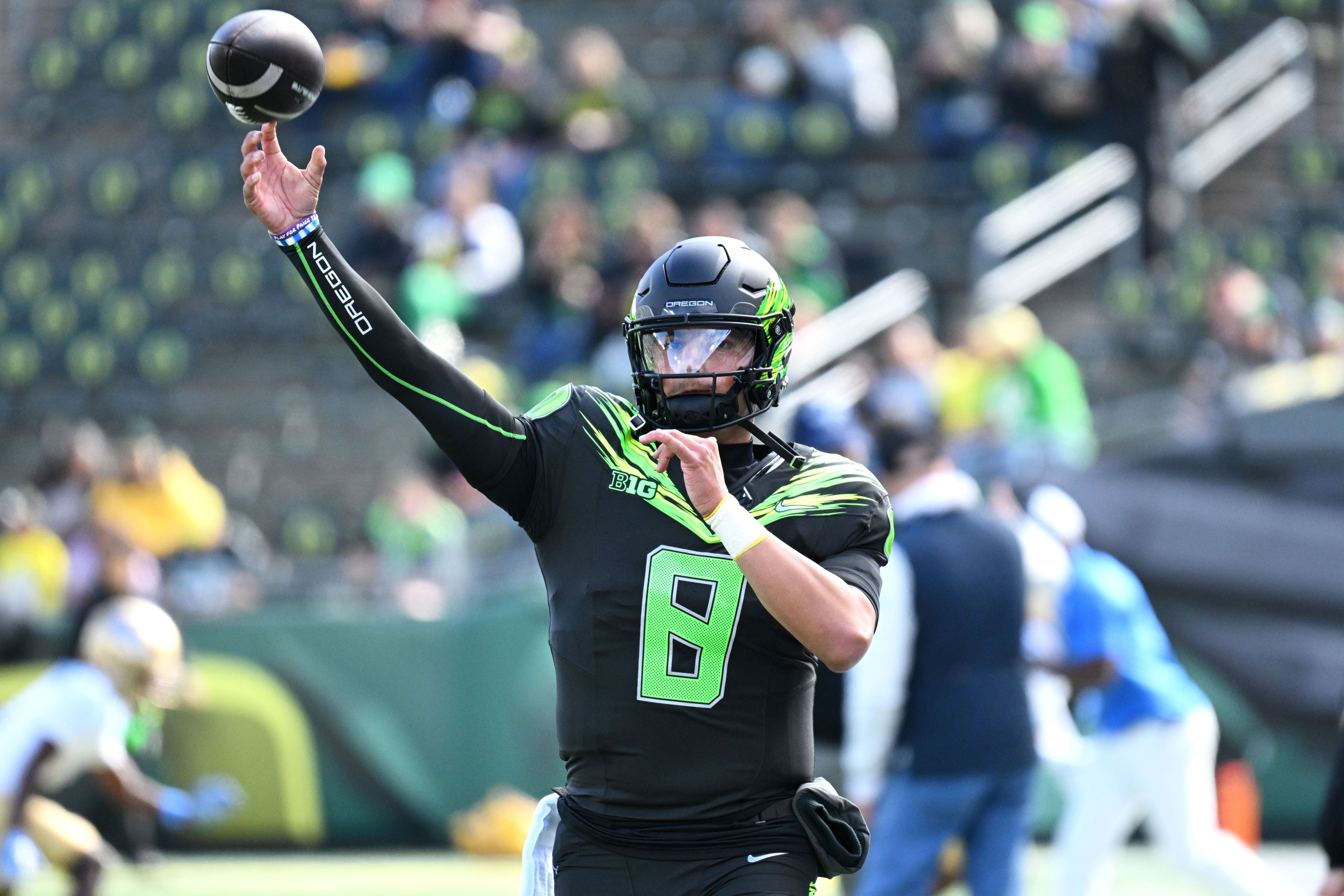 Oregon Ducks quarterback Dylan Raiola (8) warms up as we break down our Nebraska vs. Oregon prediction.