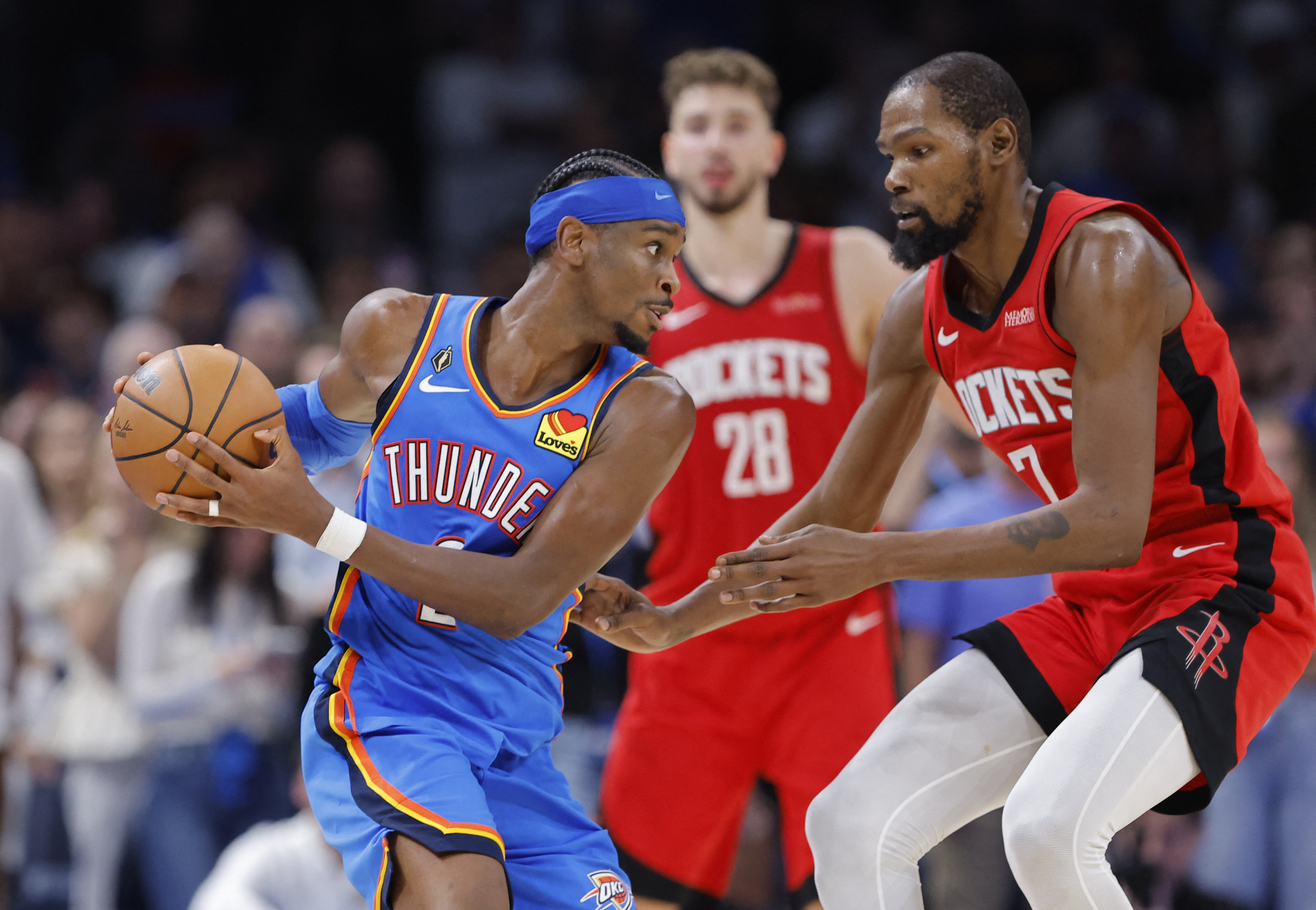 Oklahoma City Thunder guard Shai Gilgeous-Alexander (2) keeps the ball away from Houston Rockets forward Kevin Durant (7) as we offer our NBA best bets today.