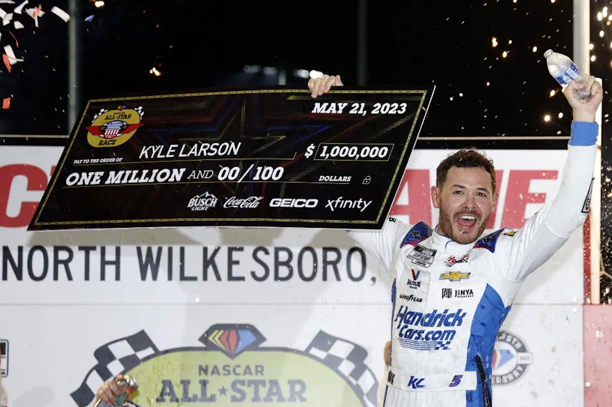 Kyle Larson celebrates after winning the NASCAR Cup Series All-Star Race at North Wilkesboro Speedway, as we offer our NASCAR All-Star Race odds and expert picks.