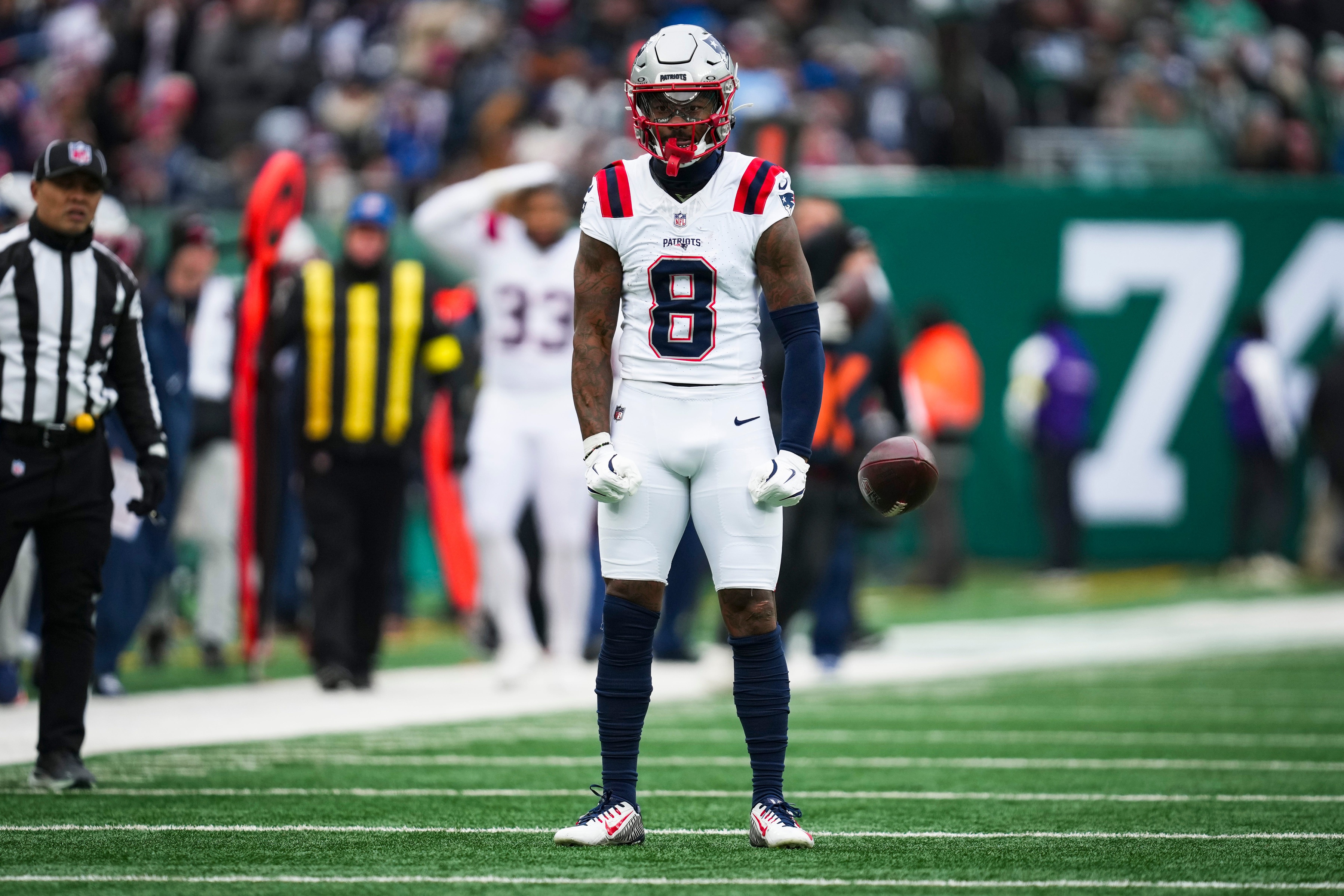 New England Patriots wide receiver Stefon Diggs (8) celebrates after a play during a game. 