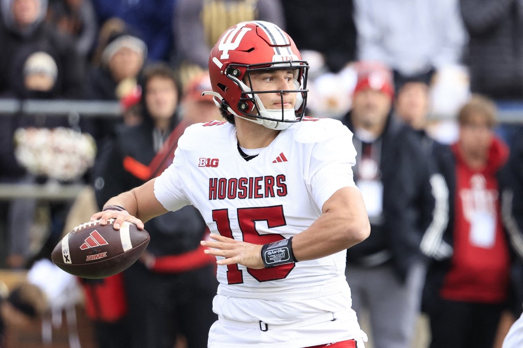 Brendan Sorsby #15 of the Indiana Hoosiers throws a pass as we look at Indiana's record sports betting revenue handle from November