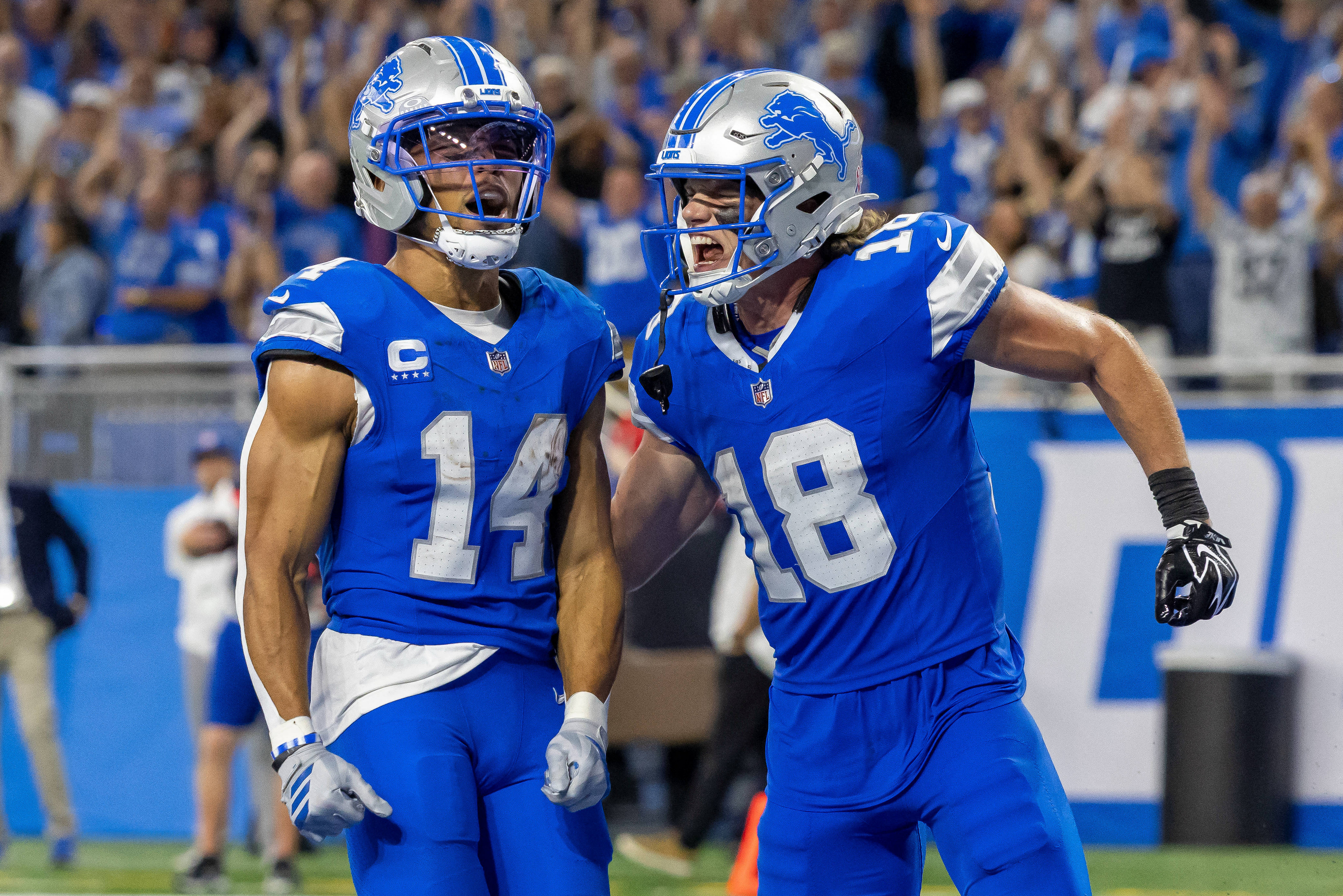 Detroit Lions wide receivers Amon-Ra St. Brown and Isaac TeSlaa celebrate a touchdown as we make our best Lions vs. Bills expert picks for TNF.