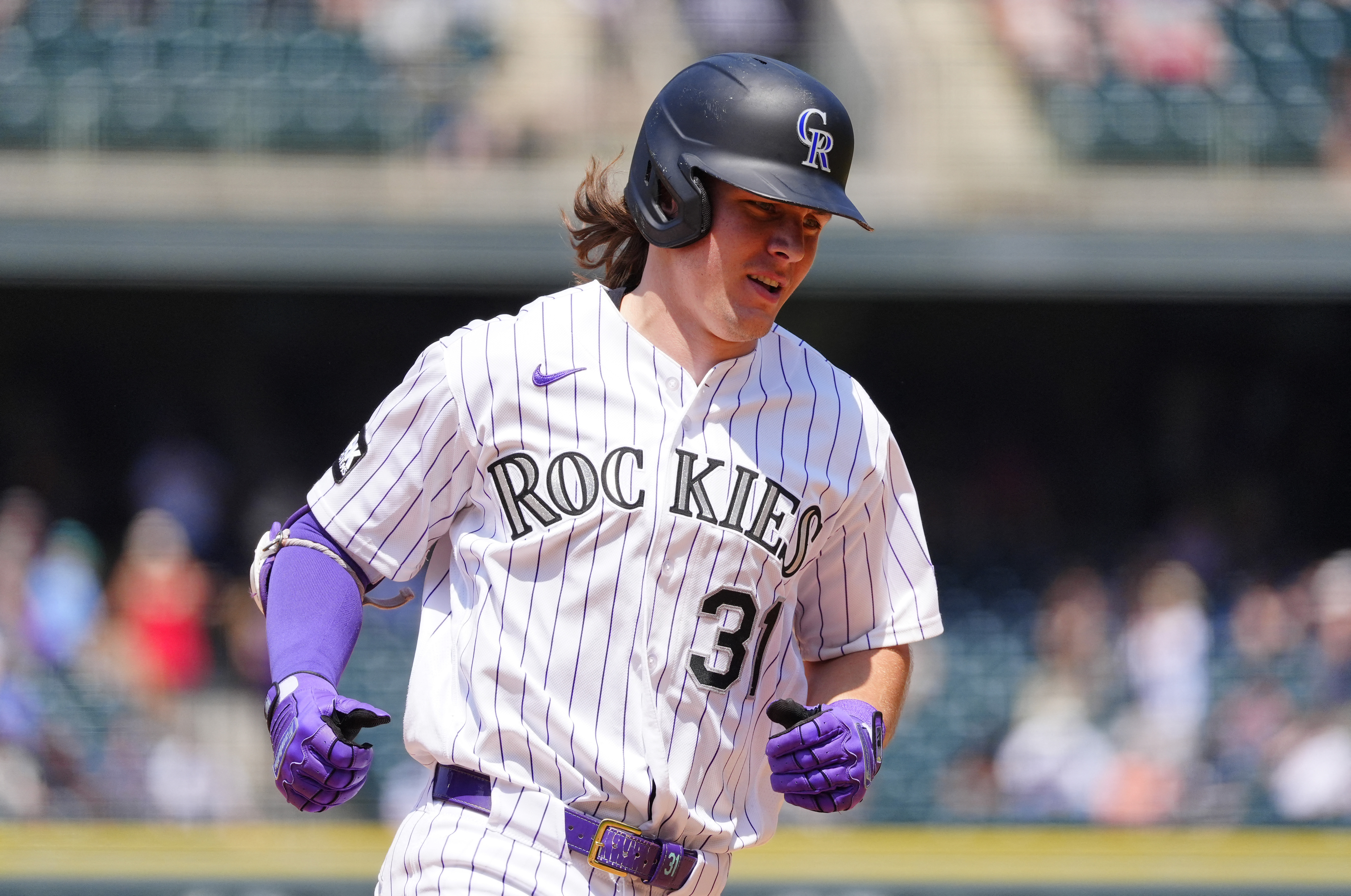 Colorado Rockies right fielder Jake McCarthy (31) runs as we break down our home run predictions today.