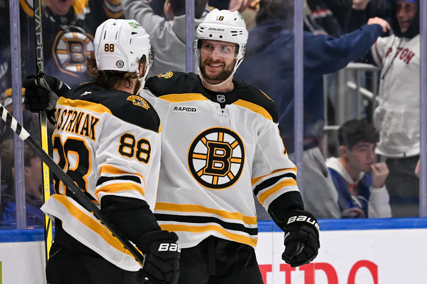 Boston Bruins center Pavel Zacha celebrates his goal with David Pastrnak against the New York Islanders, and we offer our top Penguins vs. Bruins prediction.