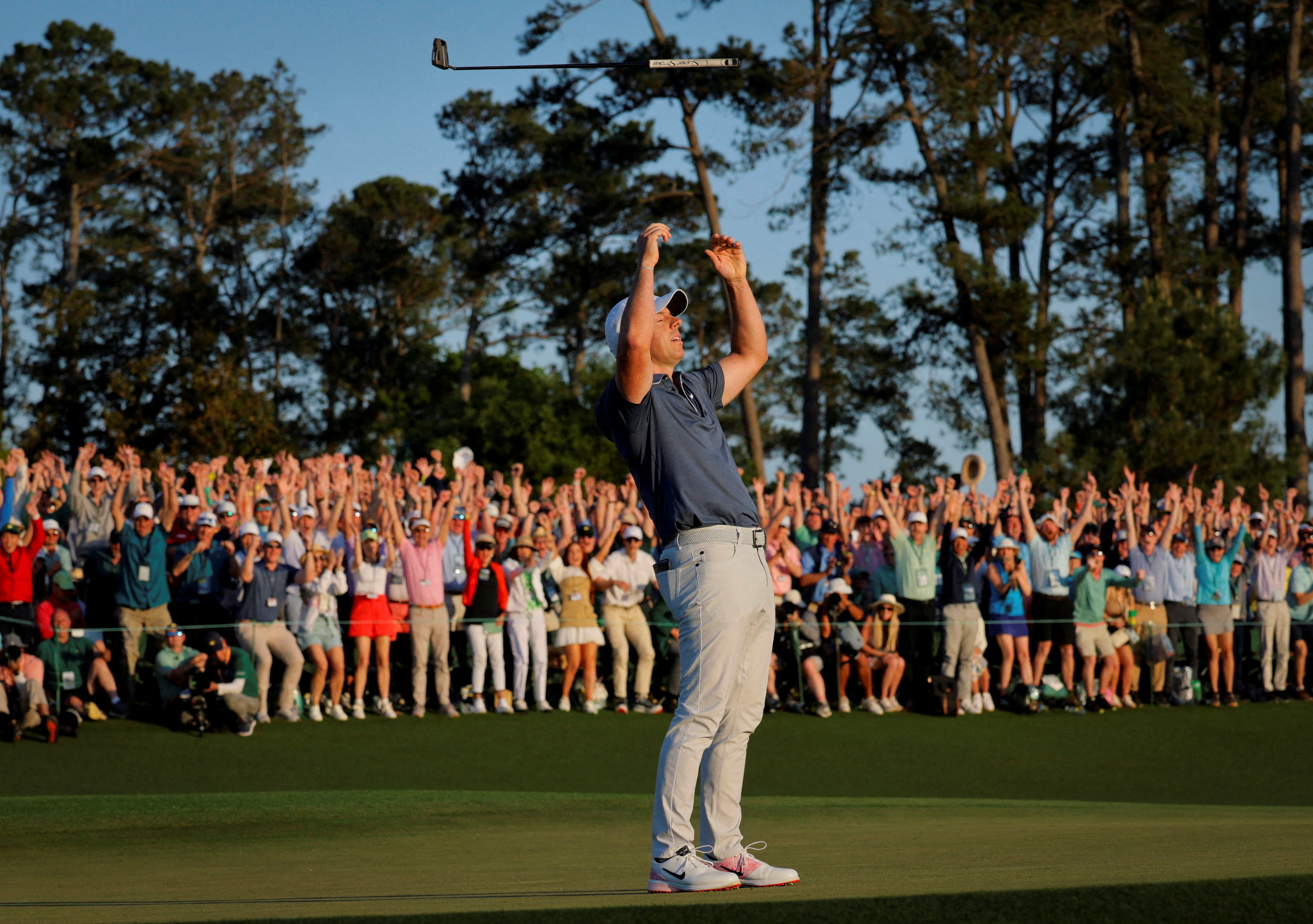 Rory McIlroy celebrates on the 18th green and 1st playoff hole after winning the Masters and completing a career grand slam. Photo by REUTERS/Brian Snyder TPX IMAGES