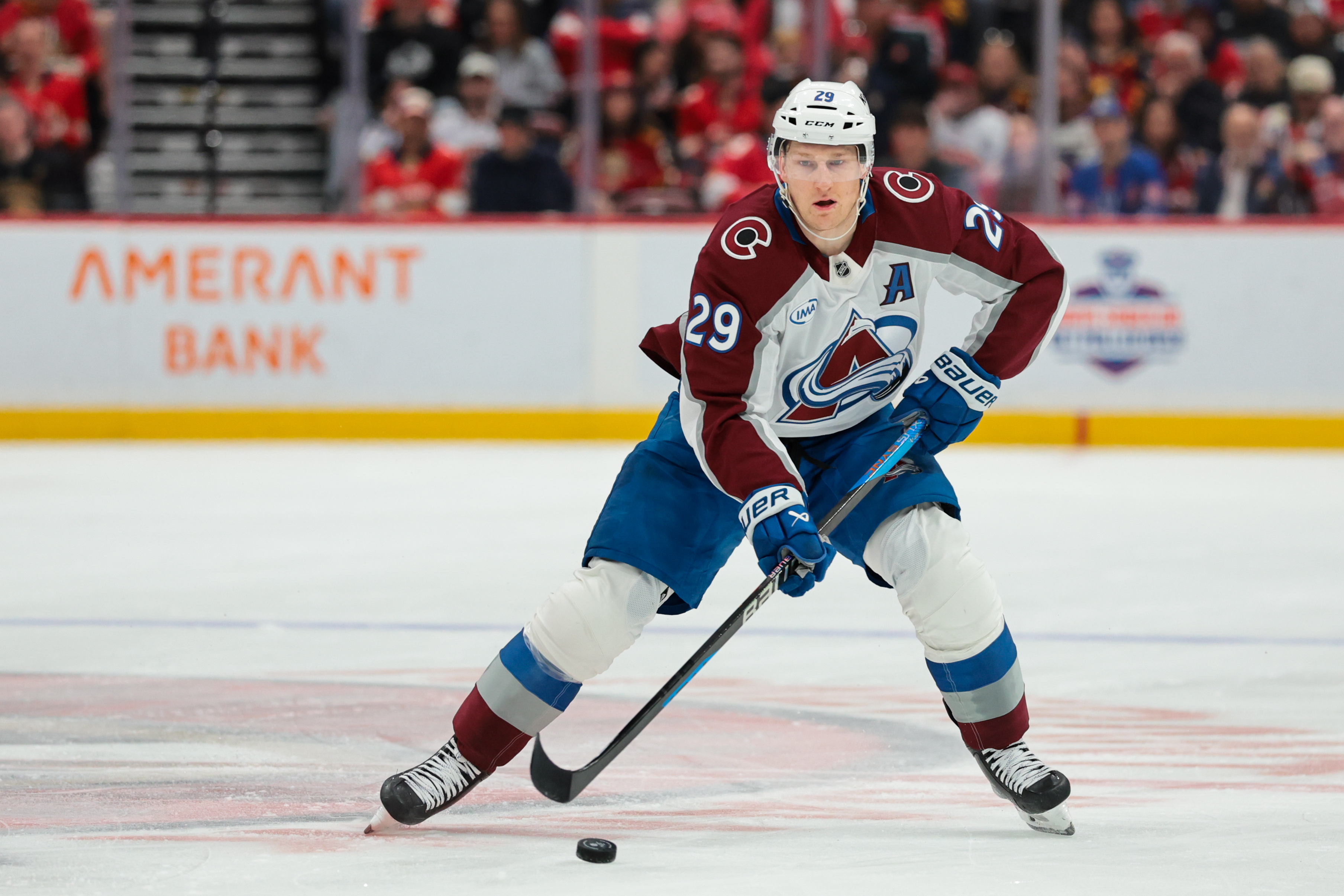 Colorado Avalanche center Nathan MacKinnon (29) moves the puck as we offer our NHL anytime goal scorer predictions today.