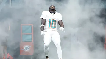 Tyreek Hill #10 of the Miami Dolphins runs onto the field during team introductions