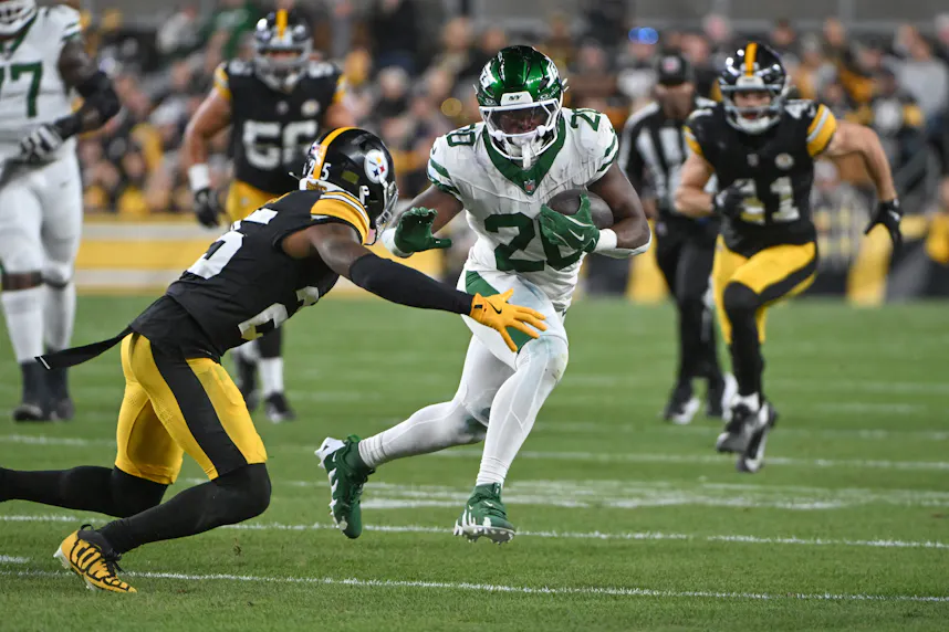 New York Jets running back Breece Hall runs against the Pittsburgh Steelers. We're backing Hall in our Texans vs. Jets TNF Parlay.