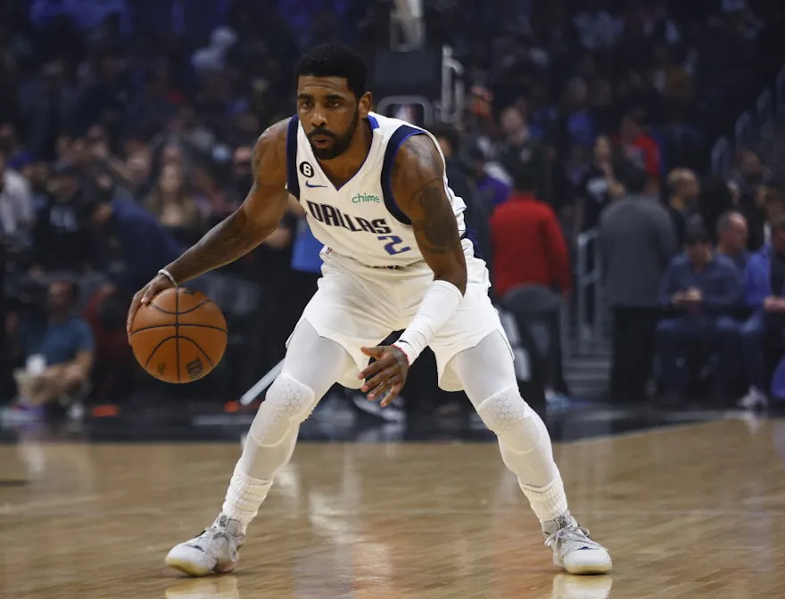 Kyrie Irving of the Dallas Mavericks dribbles the ball against the Los Angeles Lakers, and we offer new U.S. bettors our exclusive BetRivers bonus code.