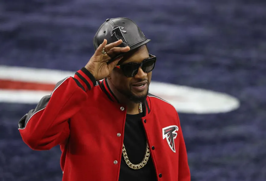 Usher looks on before Super Bowl 51 between the Atlanta Falcons and the New England Patriots, and we offer our top Super Bowl halftime show last song predictions based on the best NFL odds.