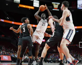Adama Sanogo of the UConn Huskies shoots the ball over Tamin Lipsey of the Iowa State Cyclones during the first half of the Phil Knight Invitational Tournament Men’s Championship at Moda Center on November 27, 2022 in Portland, Oregon.