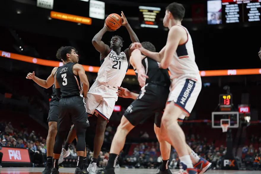 Adama Sanogo of the UConn Huskies shoots the ball over Tamin Lipsey of the Iowa State Cyclones during the first half of the Phil Knight Invitational Tournament Men’s Championship at Moda Center on November 27, 2022 in Portland, Oregon.