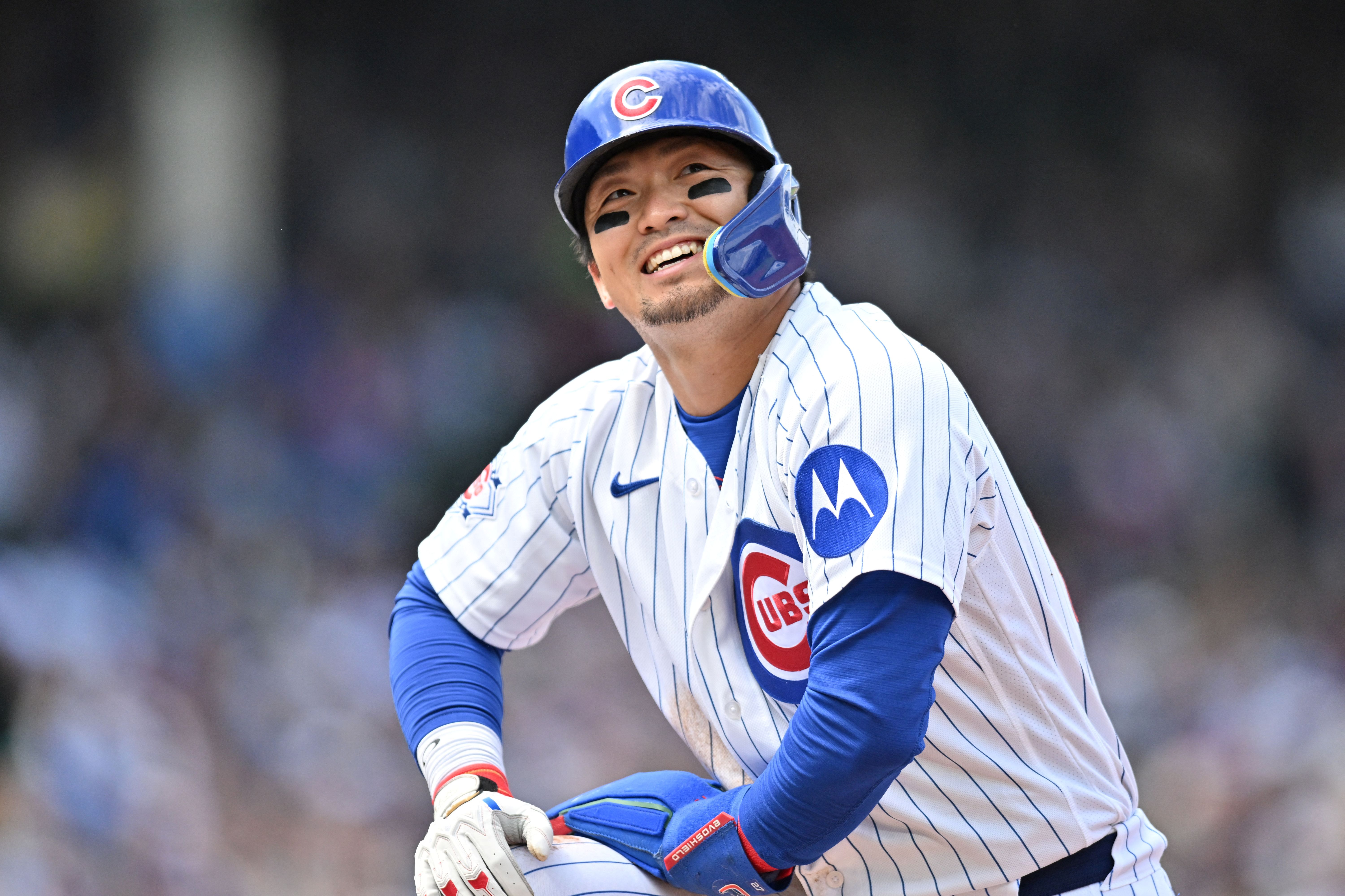 Chicago Cubs right fielder Seiya Suzuki looks up and smiles, and he's featured in our home run predictions today.