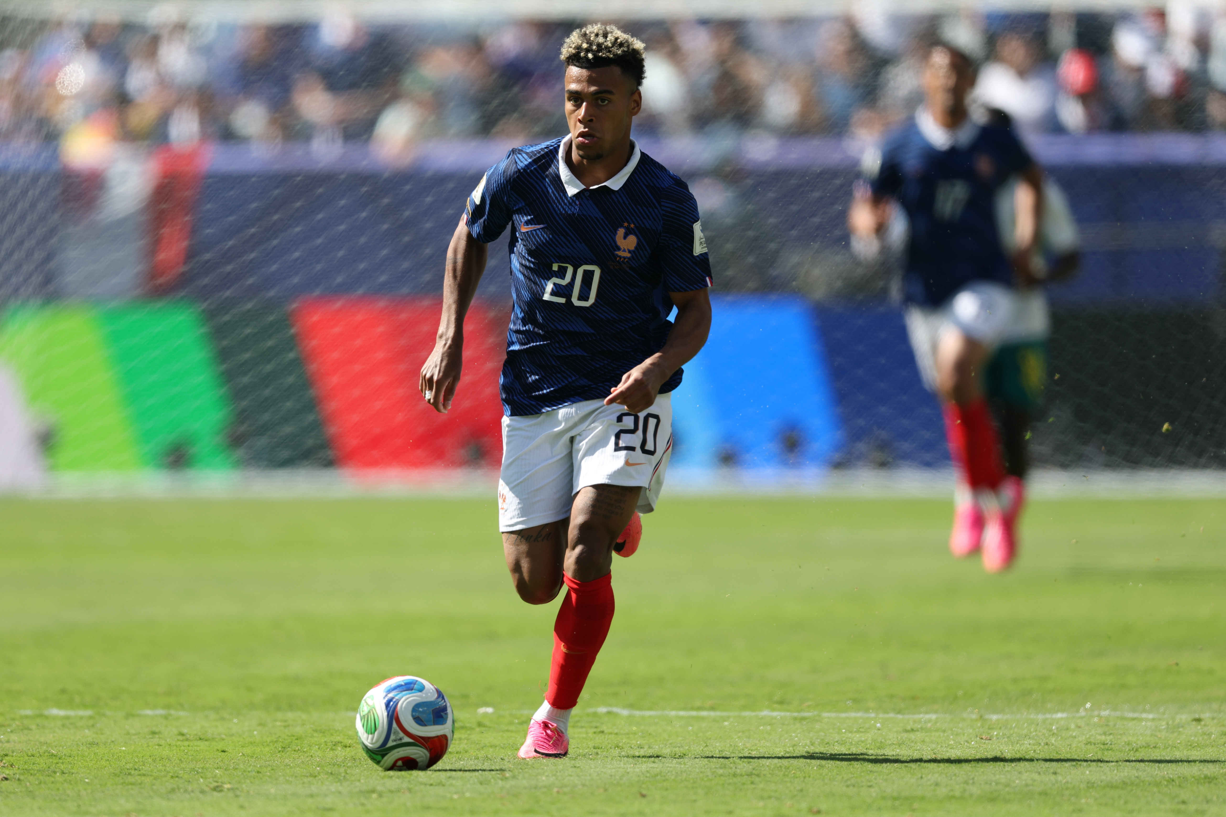 France midfielder Desire Doue controls the ball as we make our best France vs. Iraq prediction