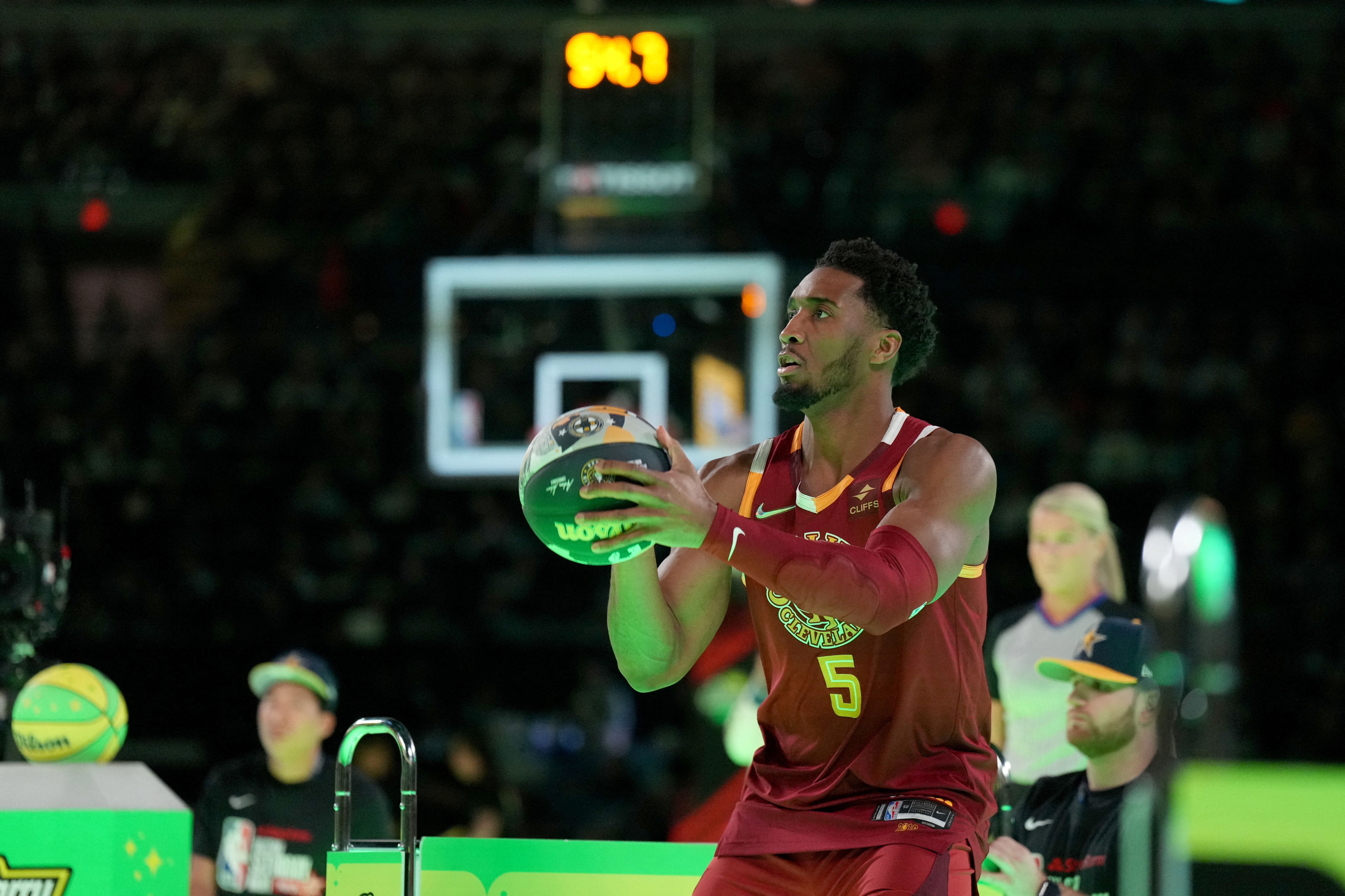 Cleveland Cavaliers guard Donovan Mitchell (45) shoots the ball as we break down our NBA 3-Point Contest predictions.