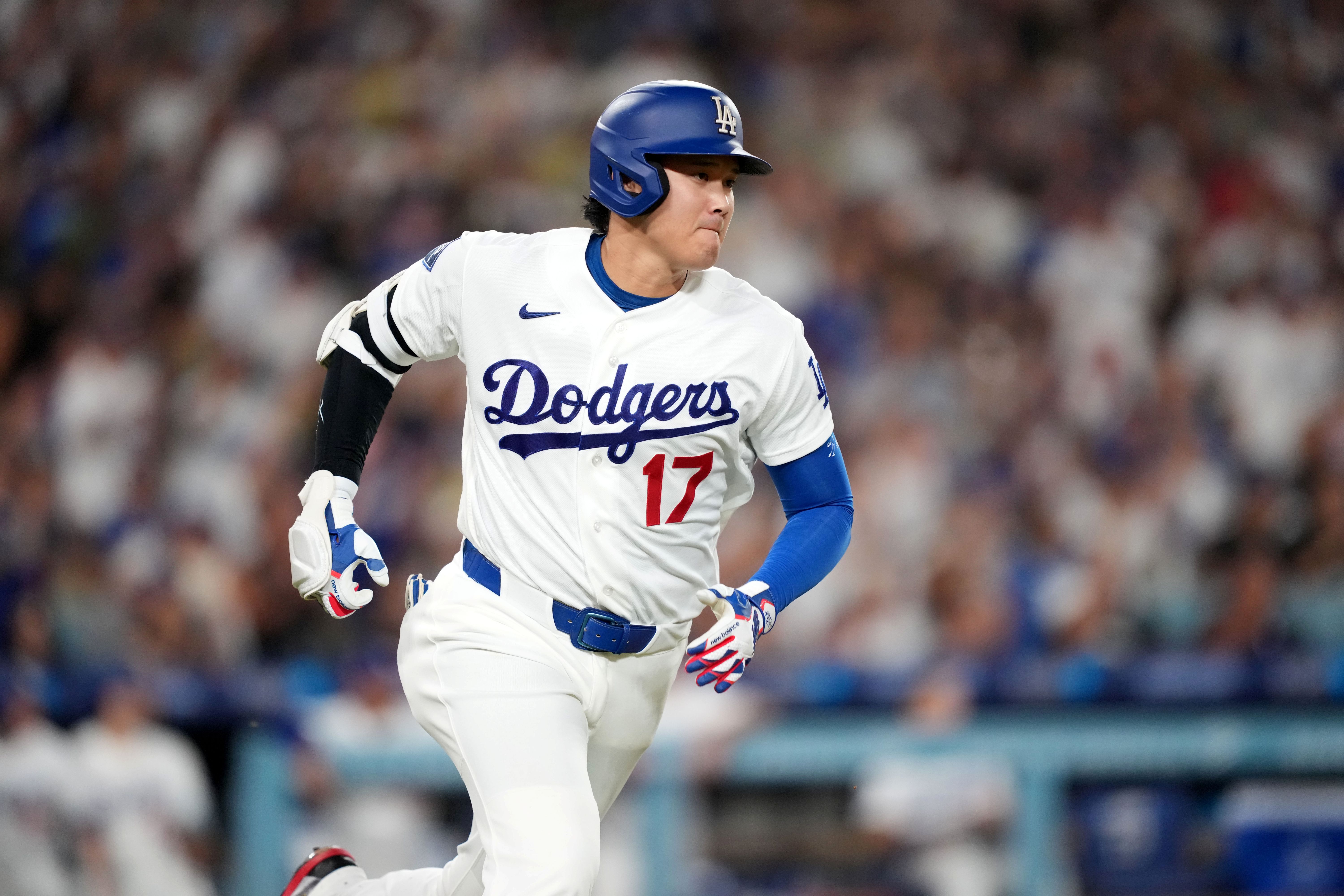 Los Angeles Dodgers designated hitter Shohei Ohtani (17) runs the bases as we break down the Dodgers vs. Braves win probability.