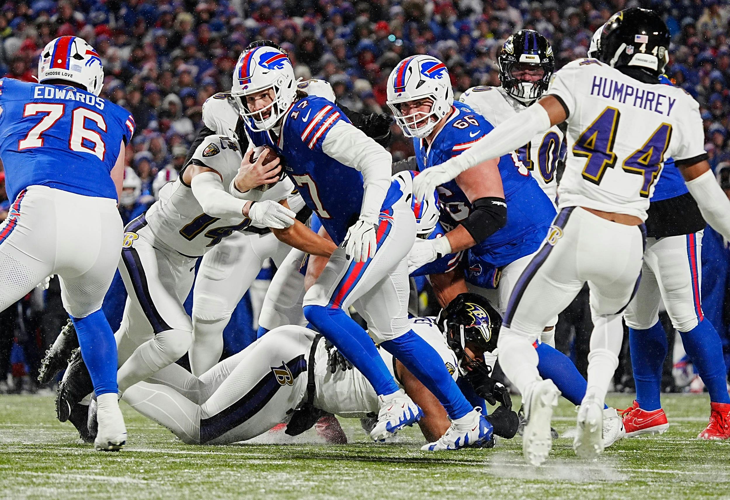 Buffalo Bills quarterback Josh Allen runs with the ball against the Baltimore Ravens as we analyze the 2025 Super Bowl odds. 