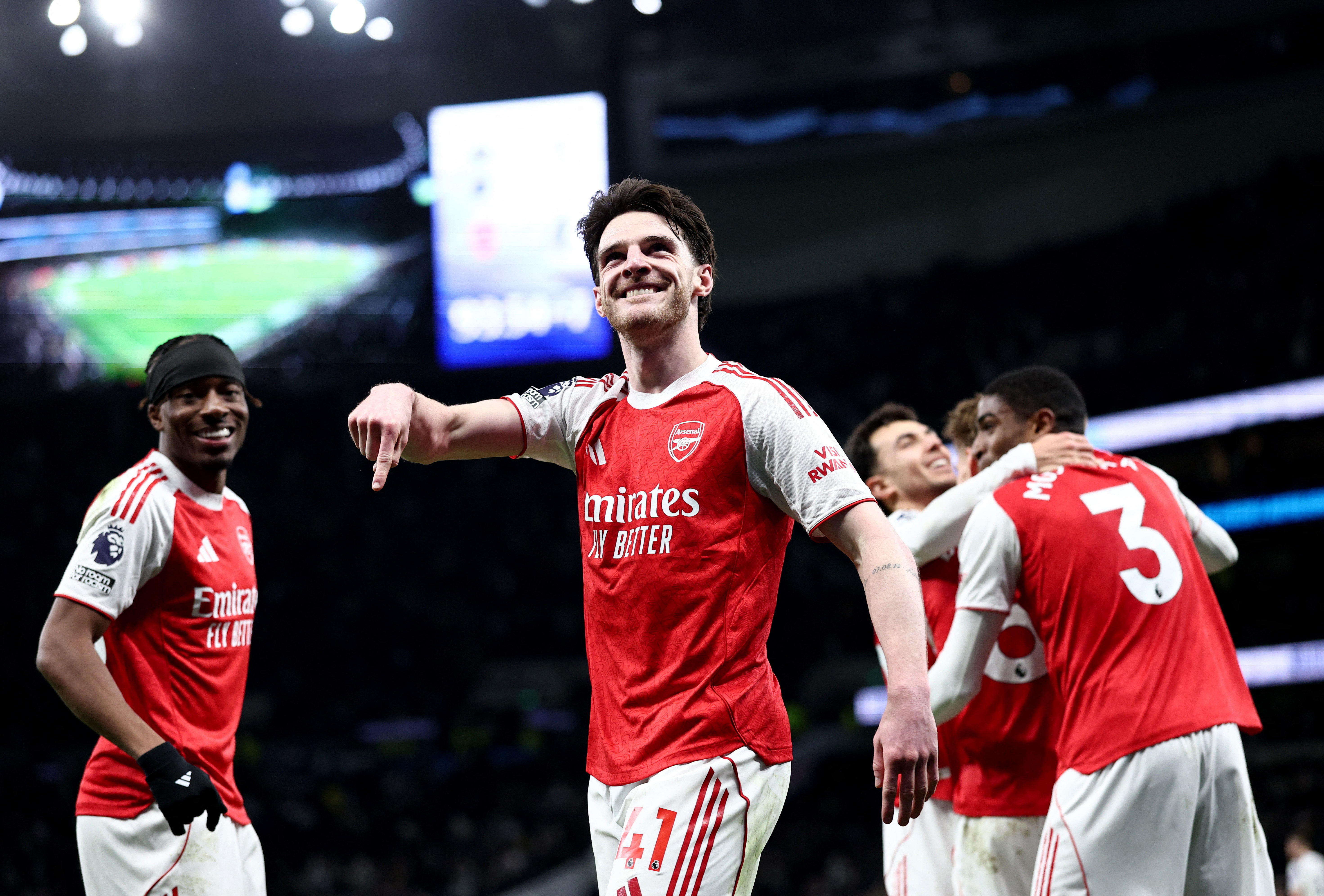 Arsenal players celebrate as we provide the Champions League odds at prediction markets. 