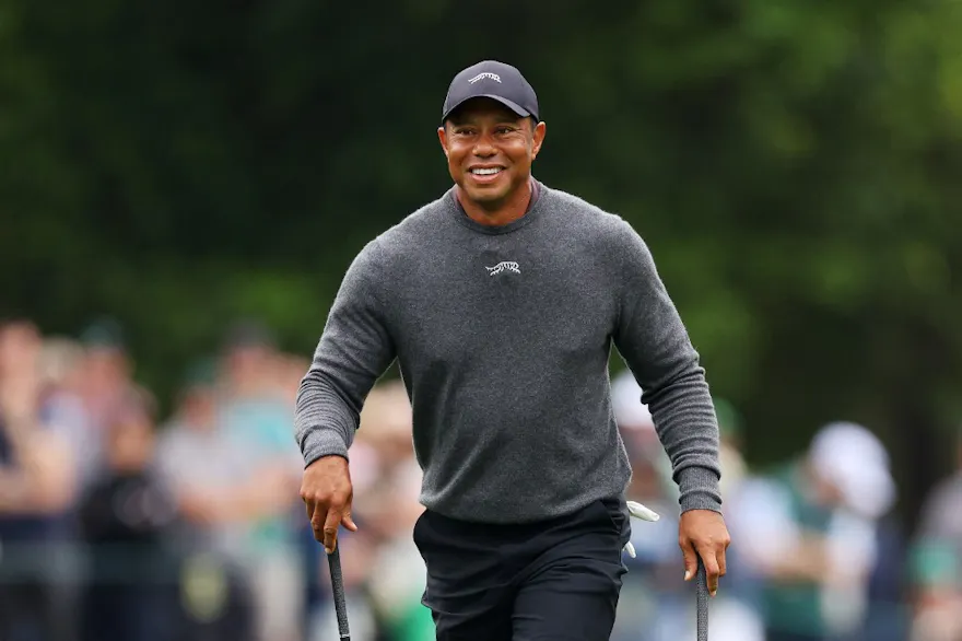Tiger Woods reacts on the eighth hole during a practice round before the 2024 Masters Tournament, and we offer our top Masters prop picks.