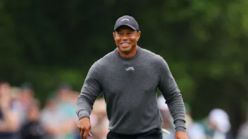 Tiger Woods reacts on the eighth hole during a practice round before the 2024 Masters Tournament, and we offer our top Masters prop picks.