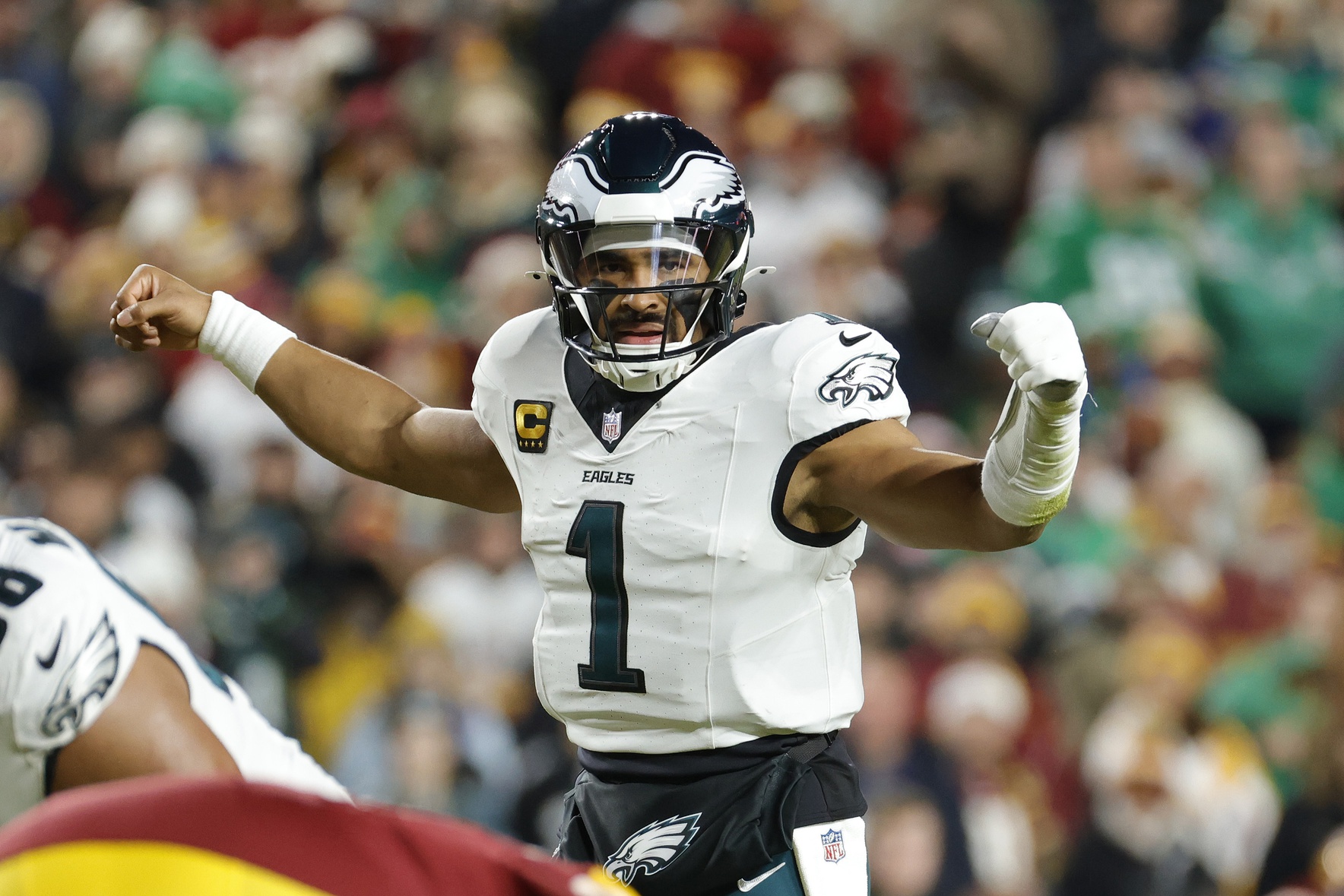 Philadelphia Eagles quarterback Jalen Hurts gestures from the field, and he leads the way in our NFL first touchdown scorer predictions for Week 17