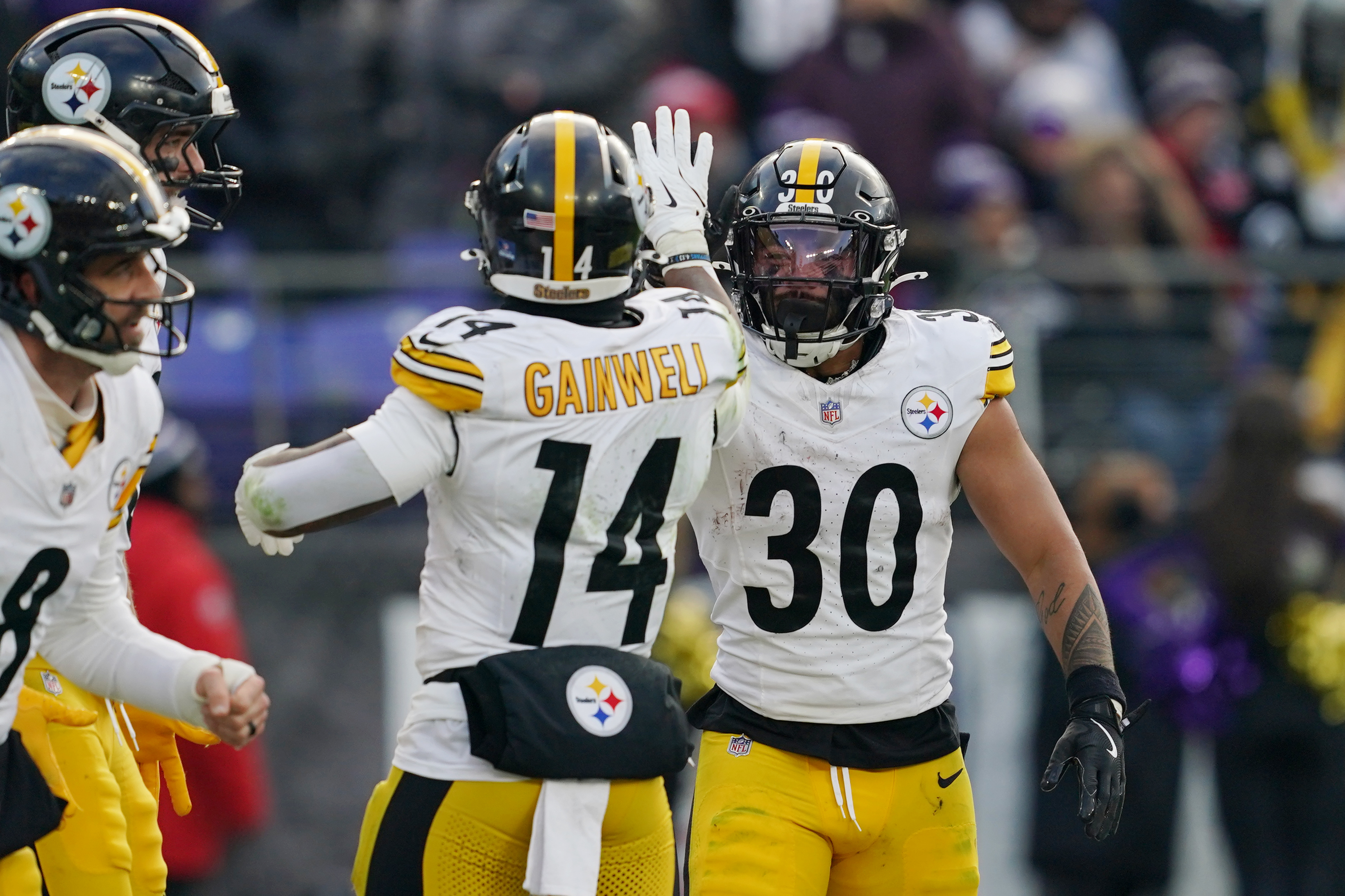 Pittsburgh Steelers running back Jaylen Warren (30) is congratulated by running back Kenneth Gainwell (14) as we break down our Dolphins vs. Steelers expert picks for Monday Night Football.