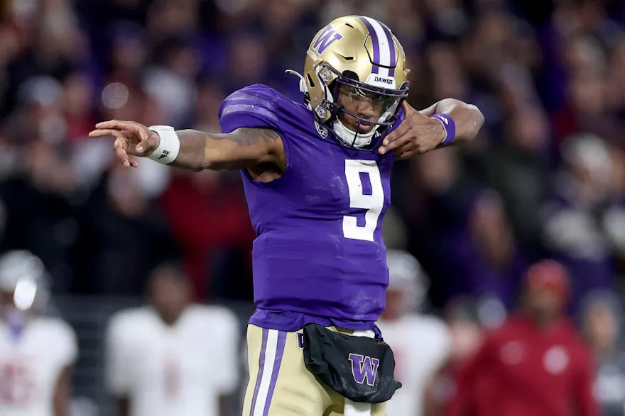 Michael Penix Jr. of the Washington Huskies reacts after a first down against the Washington State Cougars during the fourth quarter as we look at the BetRivers promo code for the College Football Playoff.