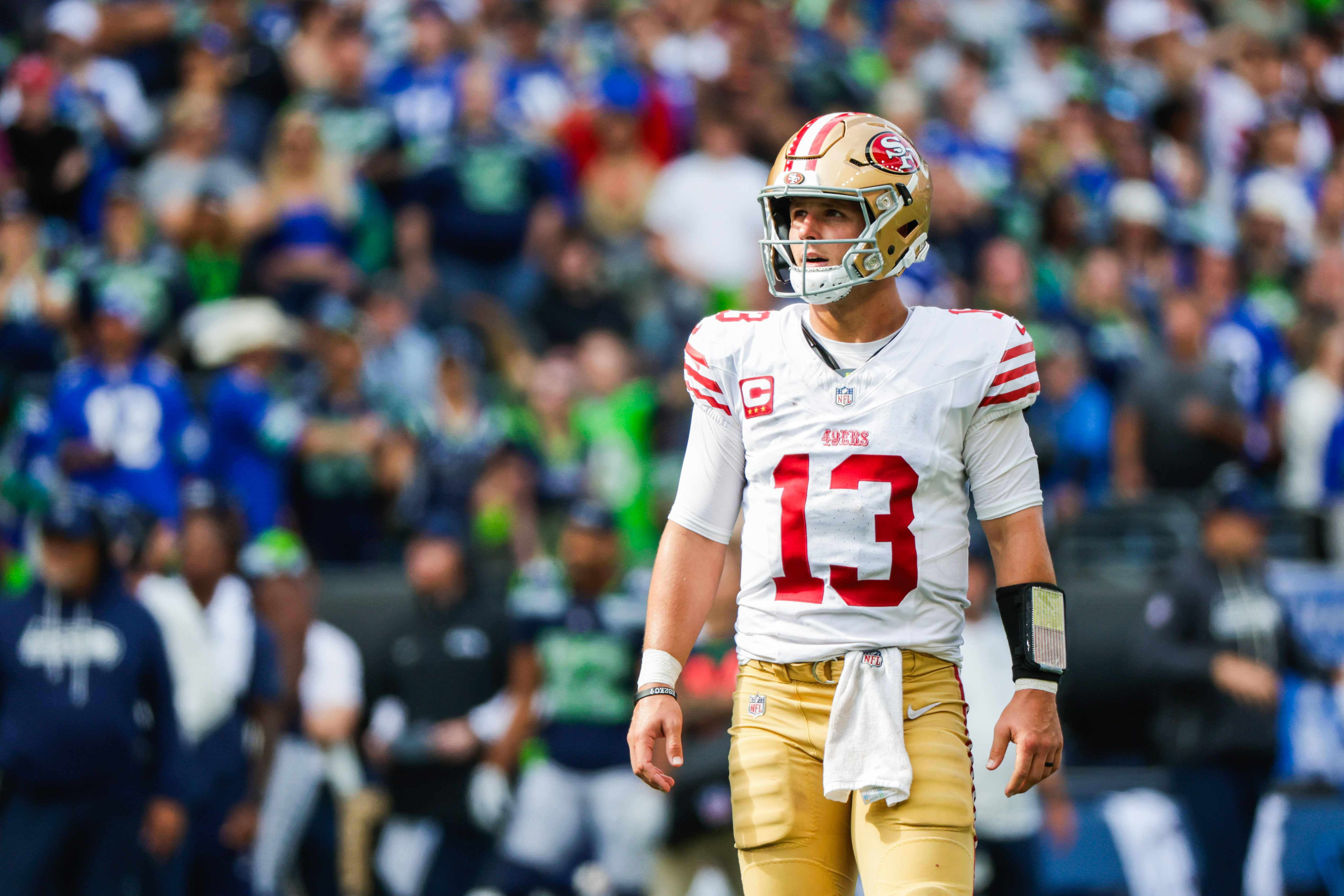 San Francisco 49ers quarterback Brock Purdy (13) looks on as we break down the NFL weather report for Week 18.