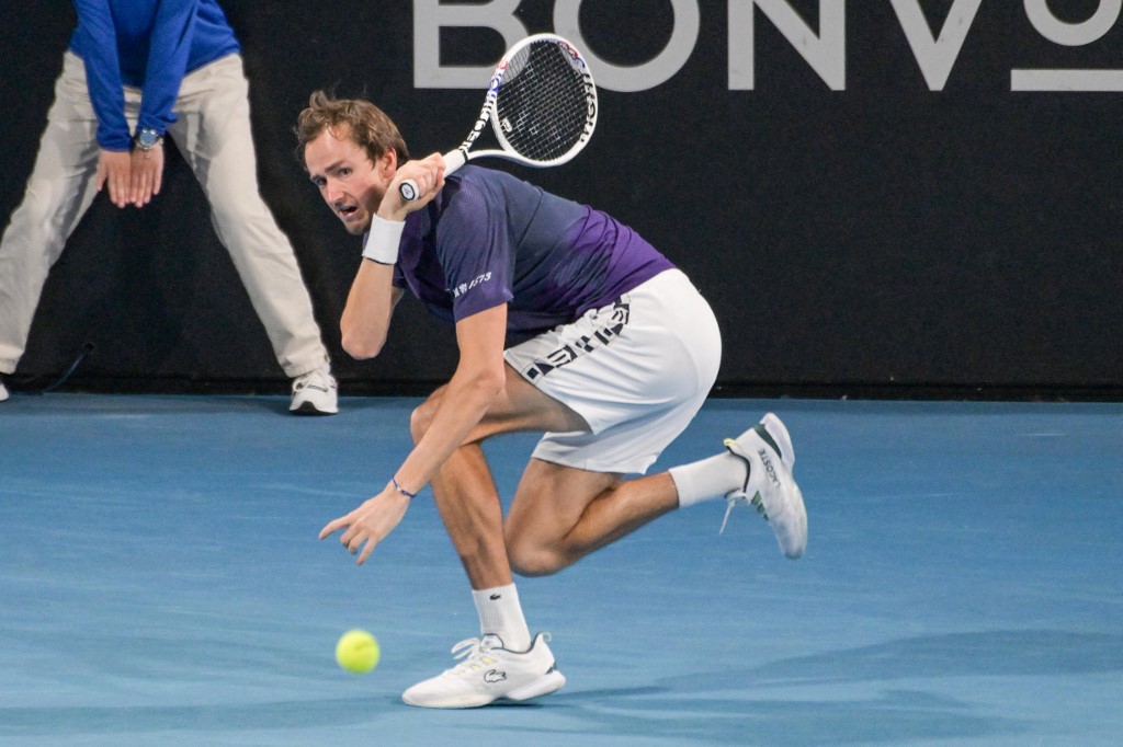 Russian tennis player Daniil Medvedev hits a return during his semi-final match against Serbian Novak Djokovic at the ATP Adelaide International tournament in Adelaide on January 7, 2023. Photo by Brenton Edwards via AFP.