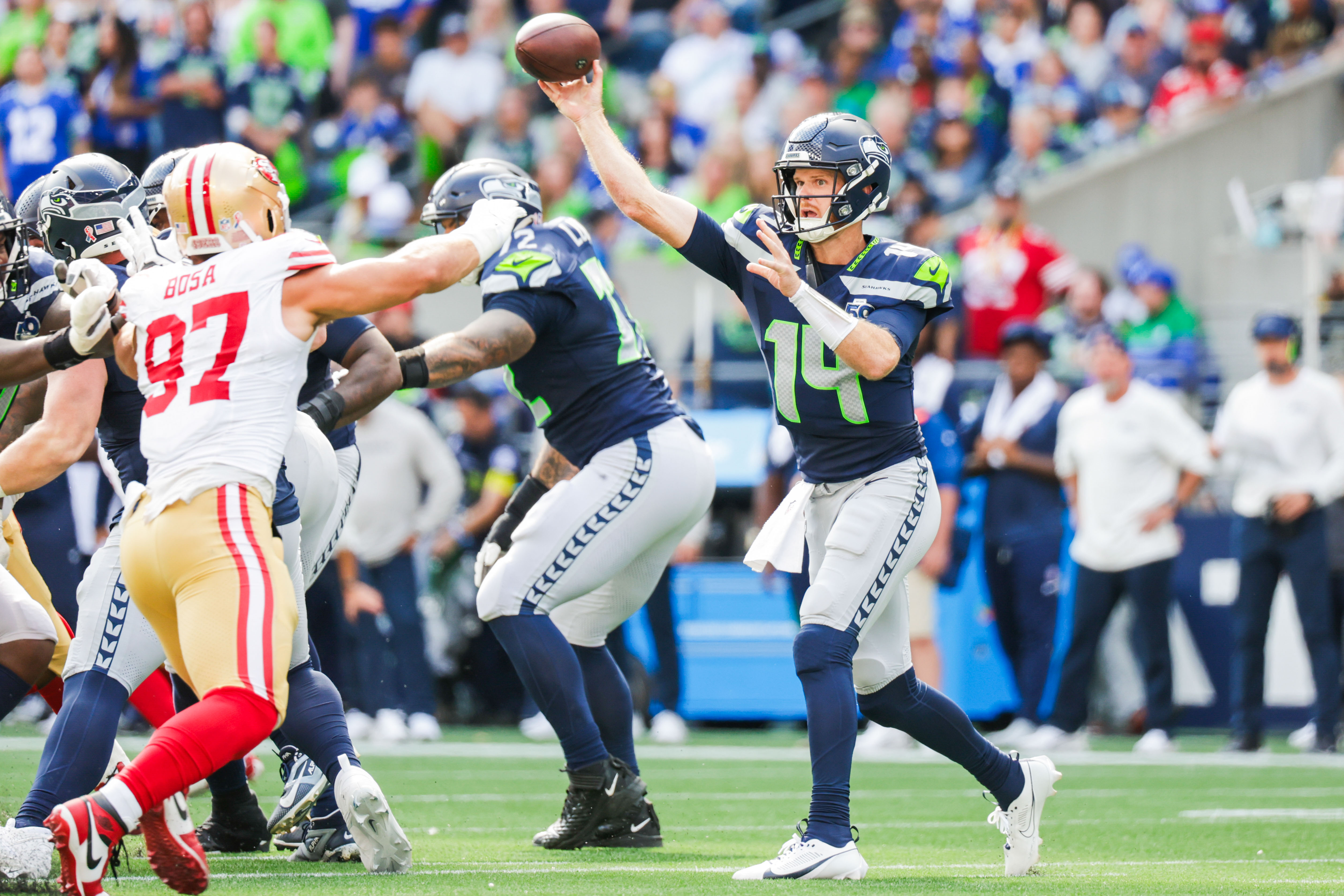 Seattle Seahawks quarterback Sam Darnold (14) passes against the San Francisco 49ers as we break down our NFL predictions for Week 18.