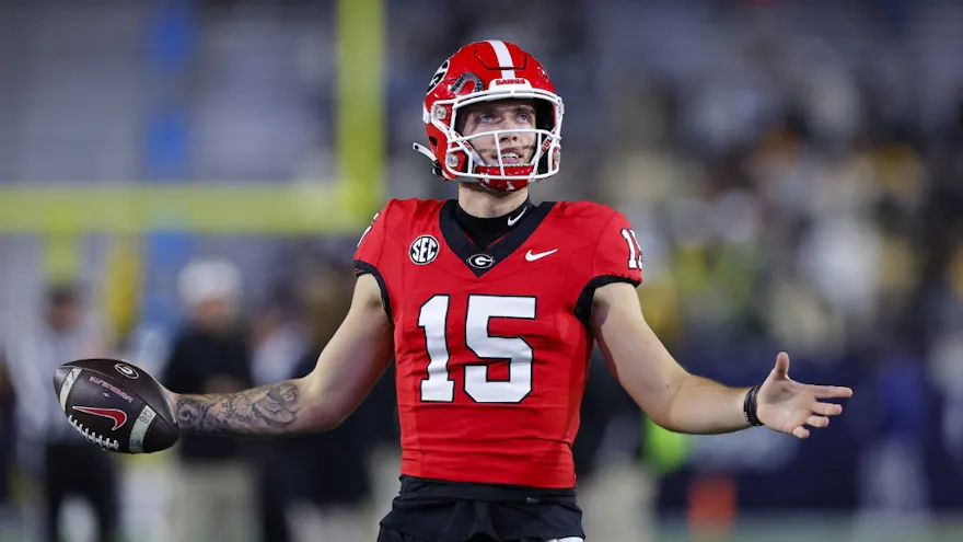 Carson Beck #15 of the Georgia Bulldogs warms up as we look at the details surrounding Georgia's latest attempt to legalize sports betting