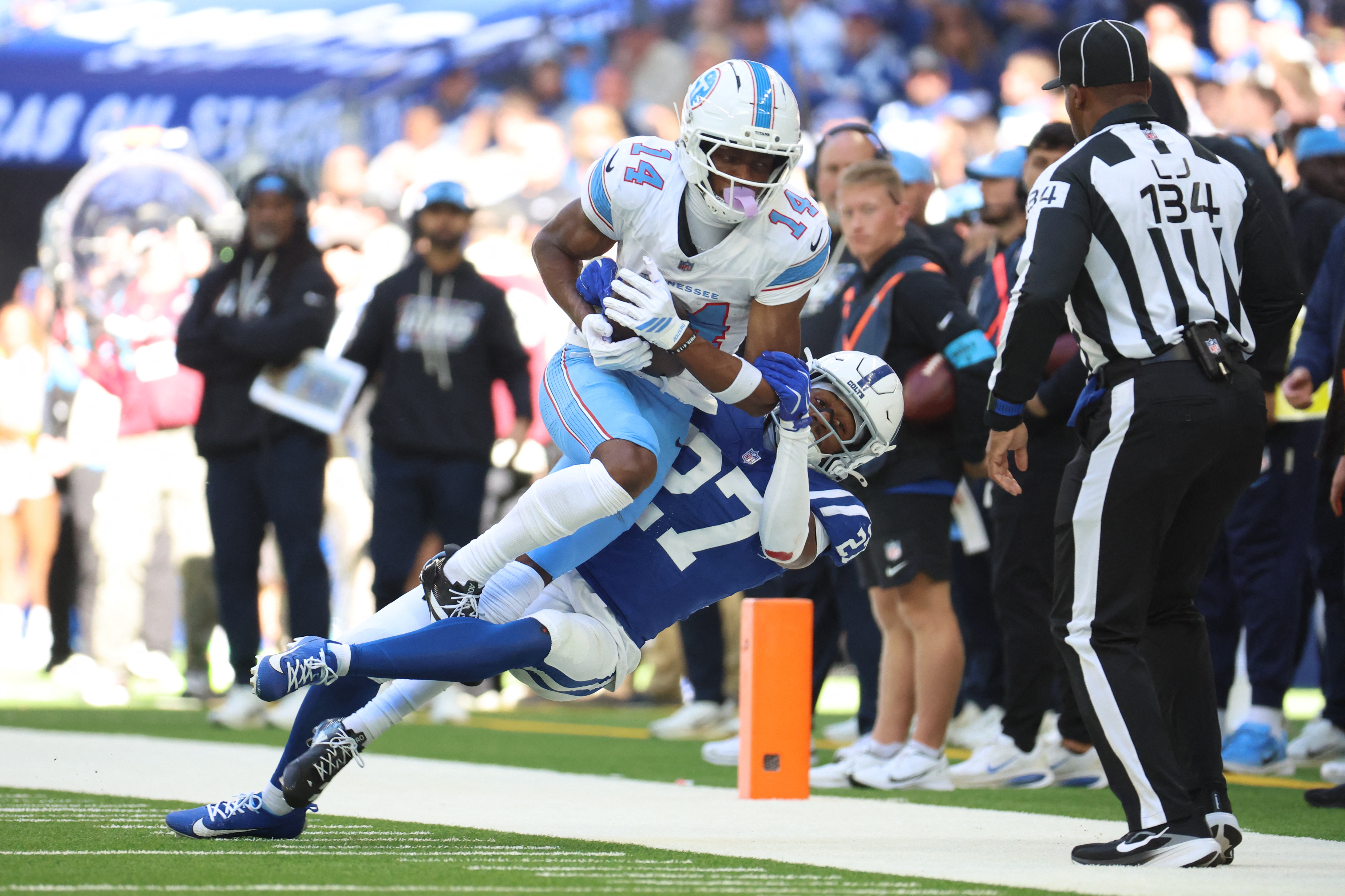 Tennessee Titans wide receiver Carnell Tate (14) catches the ball against Indianapolis Colts cornerback Justin Walley (27) during the second half at Lucas Oil Stadium. 