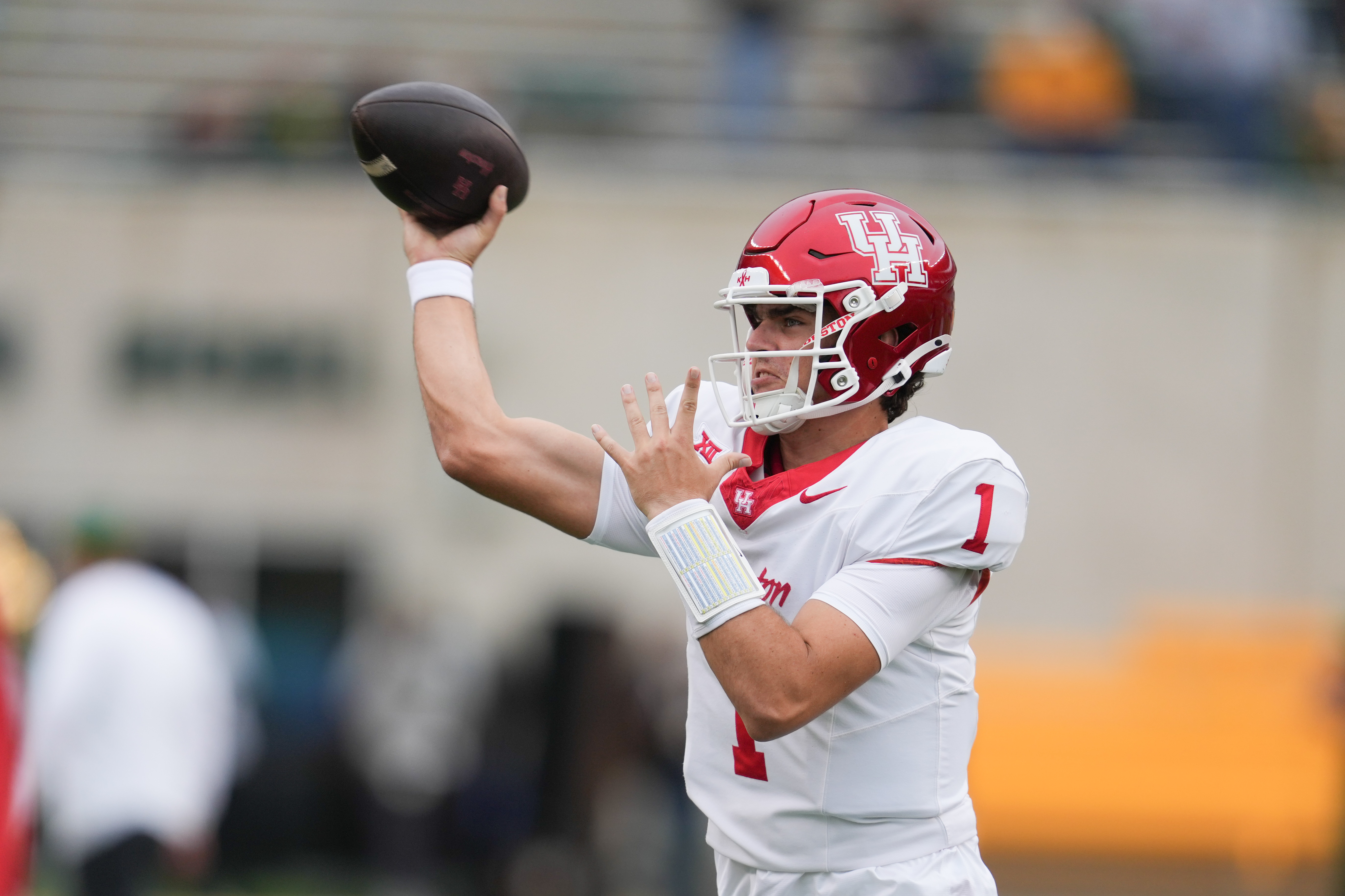 Houston Cougars quarterback Conner Weigman (1) throws as he is featured in our LSU vs. Houston player props for the Texas Bowl.