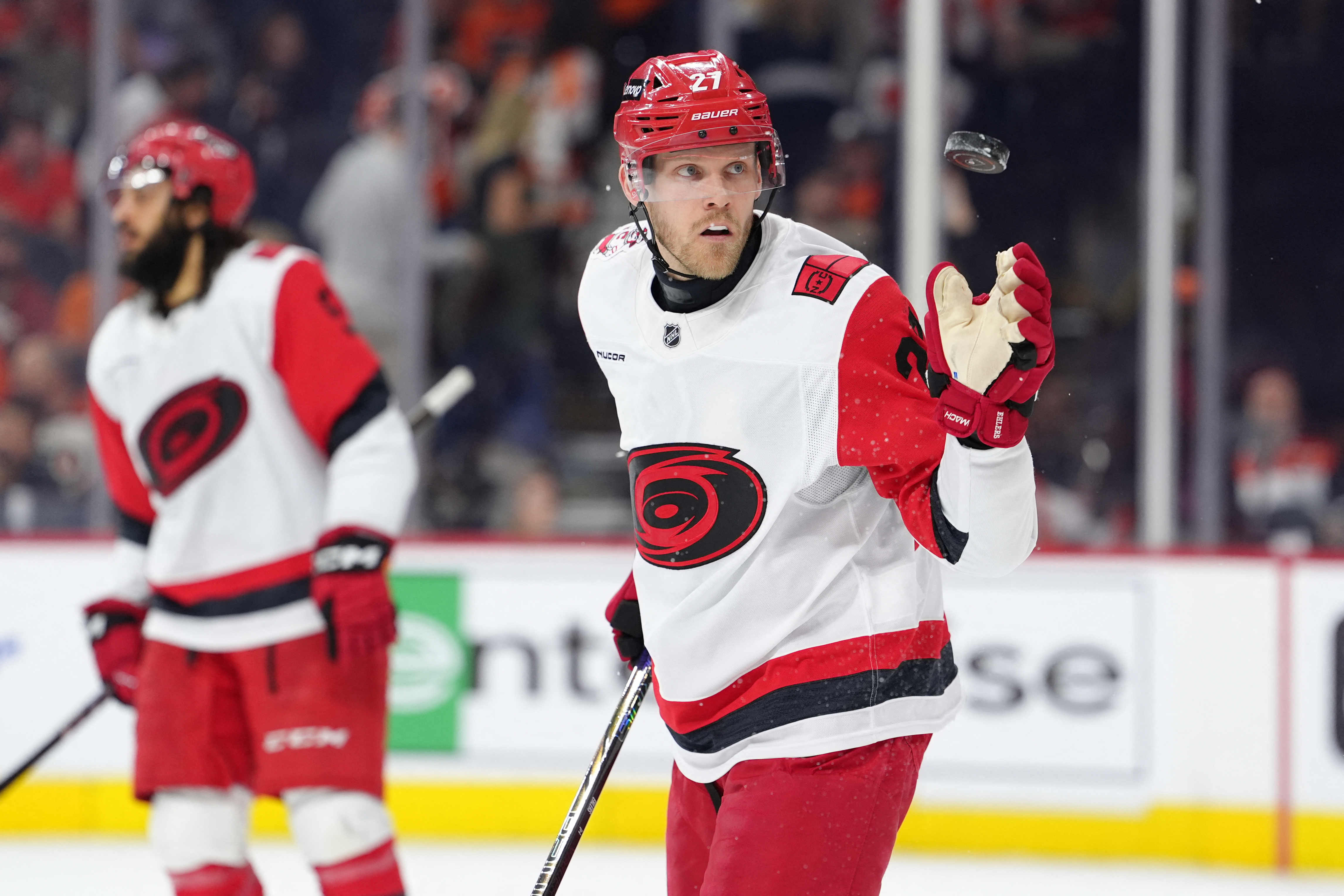 Carolina Hurricanes left wing Nikolaj Ehlers (27), seen here tossing a puck during a game, is featured in our Hurricanes vs. Canadiens prediction and odds tonight.
