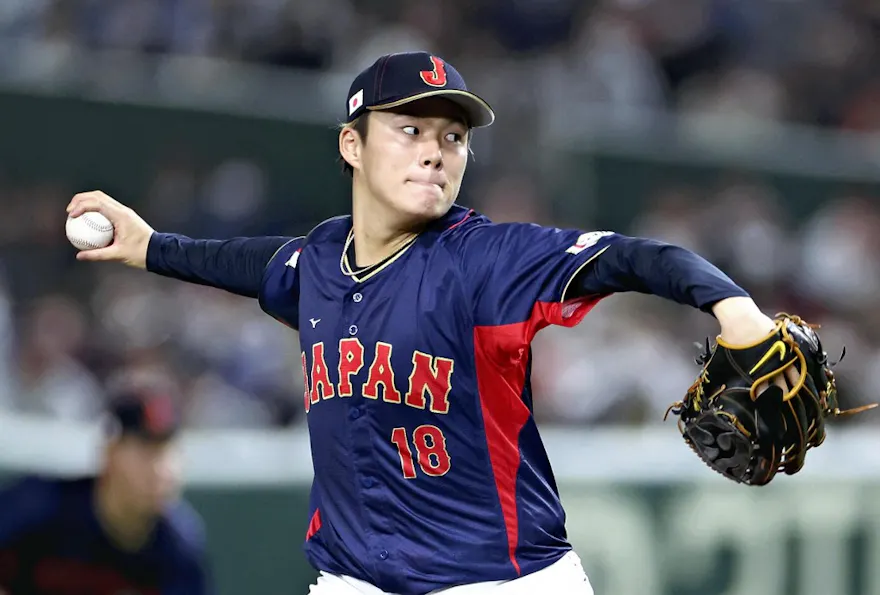 Yoshinobu Yamamoto of Japan throws a ball during the World Baseball Classic (WBC) match between Australia and Japan at Tokyo Dome as we look at the Yoshinobu Yamamoto next team odds.