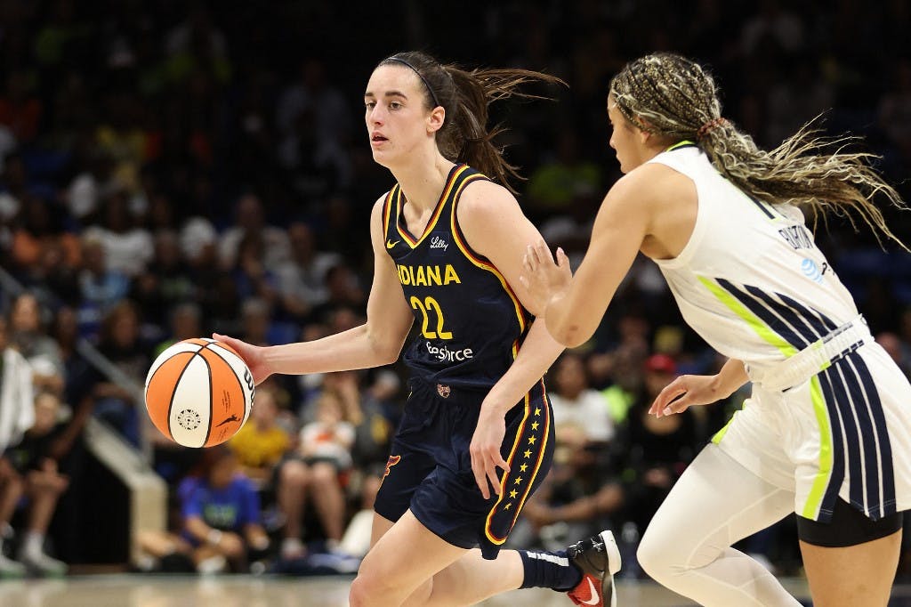 Caitlin Clark #22 of the Indiana Fever plays against the Dallas Wings during a preseason game at College Park Center on May 03, 2024 in Arlington, Texas, kicking off what could be the greatest career in WNBA history.<br>