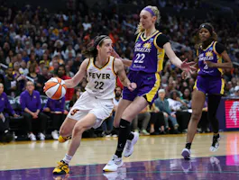 Caitlin Clark (22) of the Indiana Fever dribbles in front of Cameron Brink (22) and Rickea Jackson (2) of the Los Angeles Sparks, as we offer our best Sparks vs. Fever prediction for Tuesday's WNBA game at Gainbridge Fieldhouse in Indianapolis.