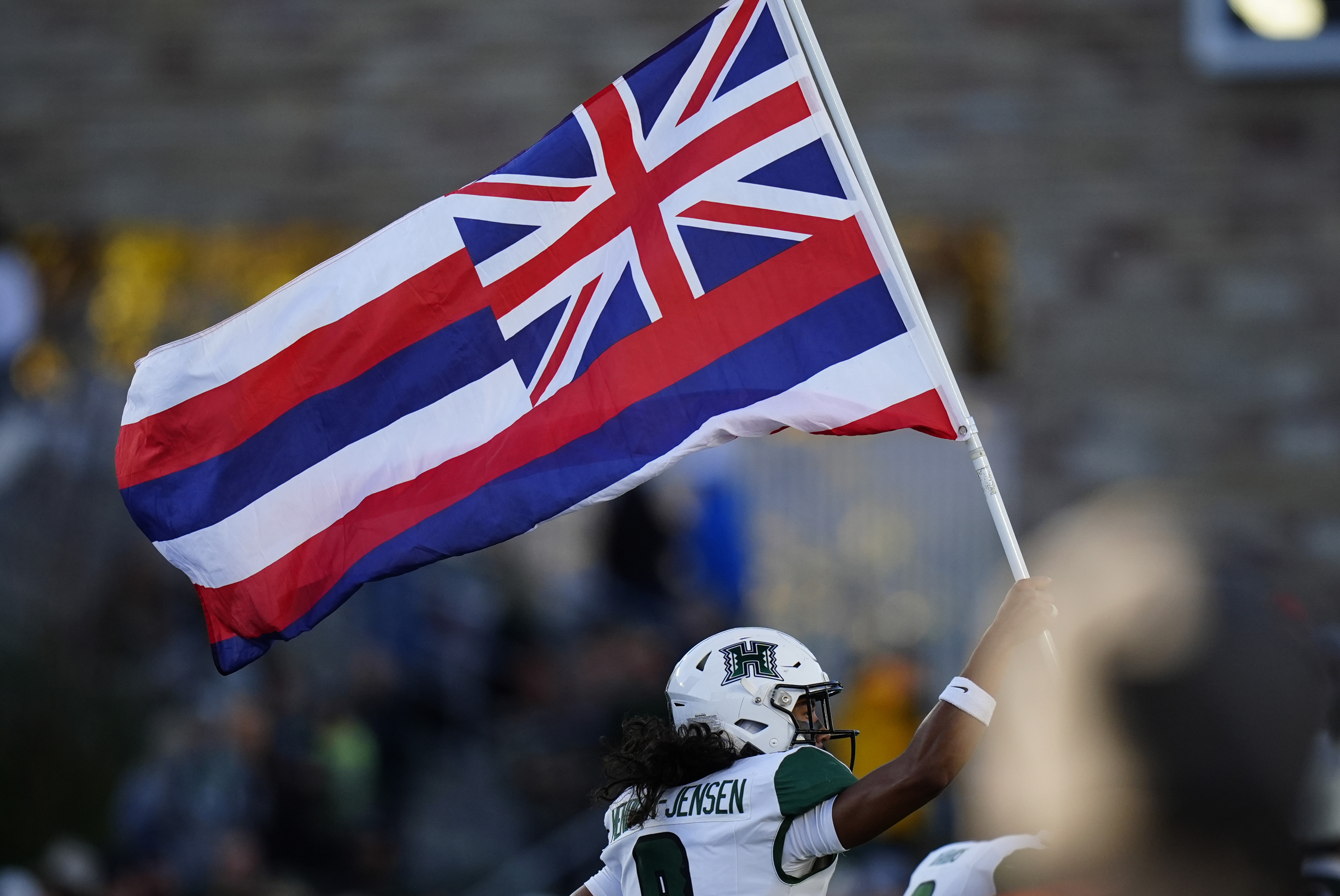  Hawaii Rainbow Warriors defensive back Kilinahe Mendiola-Jensen with the state flag as we look at the committee formed to investigate legal gambling in the state.