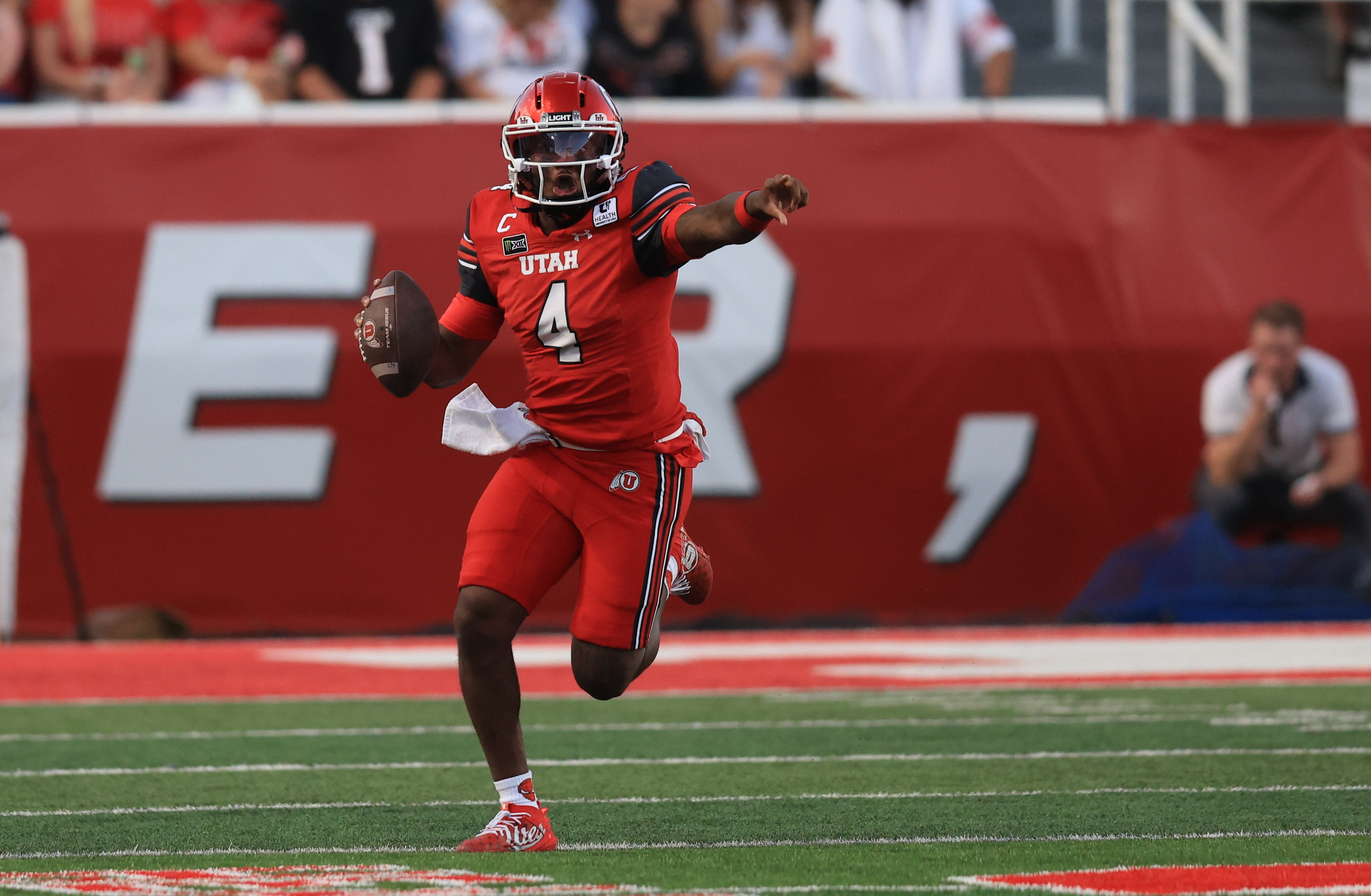 Utah quarterback Devon Dampier (4) looks to throw as we break down our Utah State vs. Utah prediction.