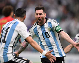 Argentina's forward #10 Lionel Messi celebrates scoring the opening goal with his teammate Argentina's midfielder #11 Angel Di Maria during the Qatar 2022 World Cup Group C football match between Argentina and Mexico at the Lusail Stadium in Lusail, north