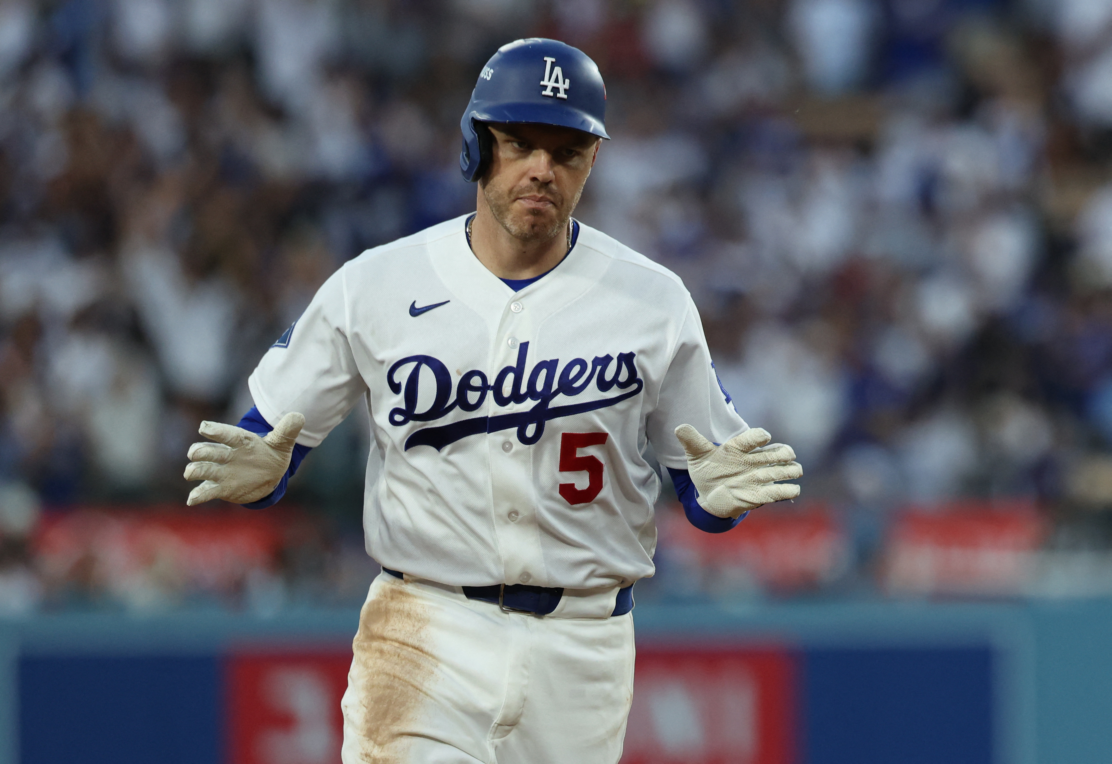 Los Angeles Dodgers first baseman Freddie Freeman rounds the bases as we make our best Dodgers vs. Braves prediction