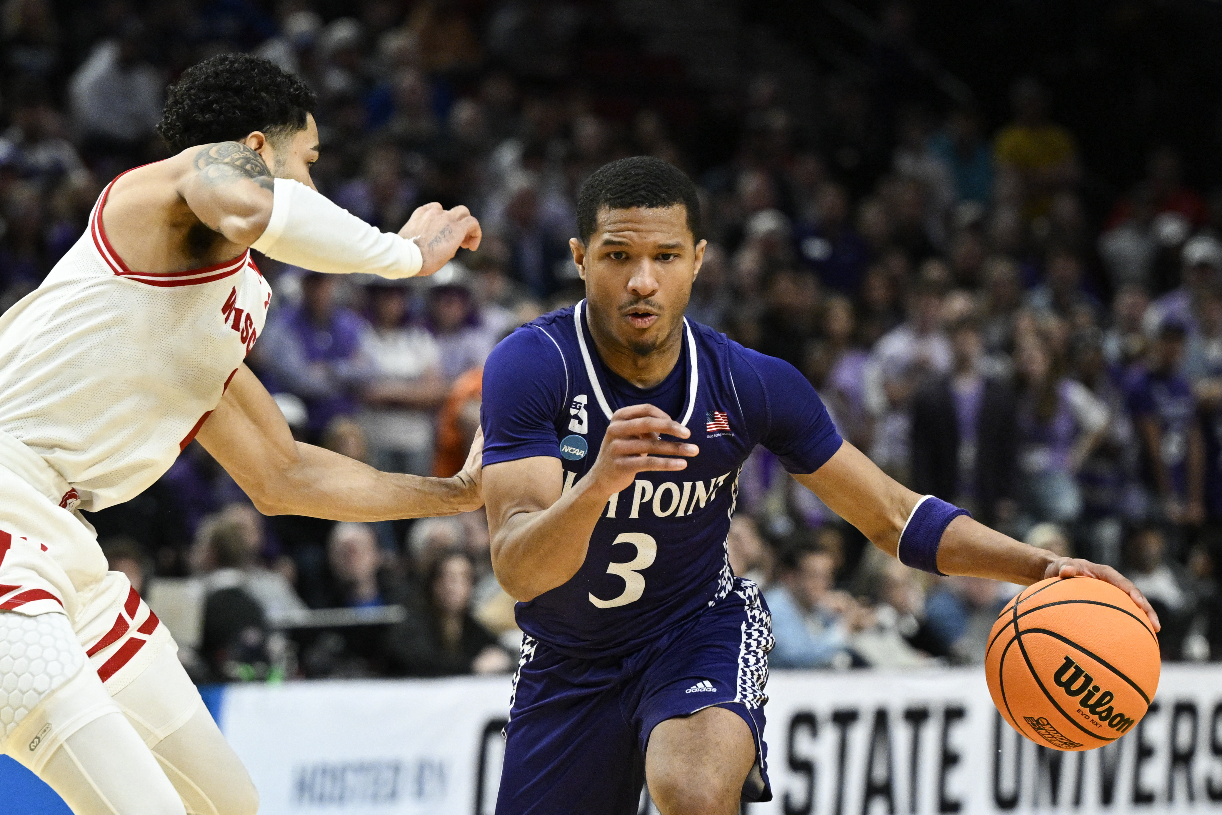 High Point Panthers guard Rob Martin (3), featured in our High Point vs. Arkansas prediction, drives against Wisconsin during the first round at Moda Center.