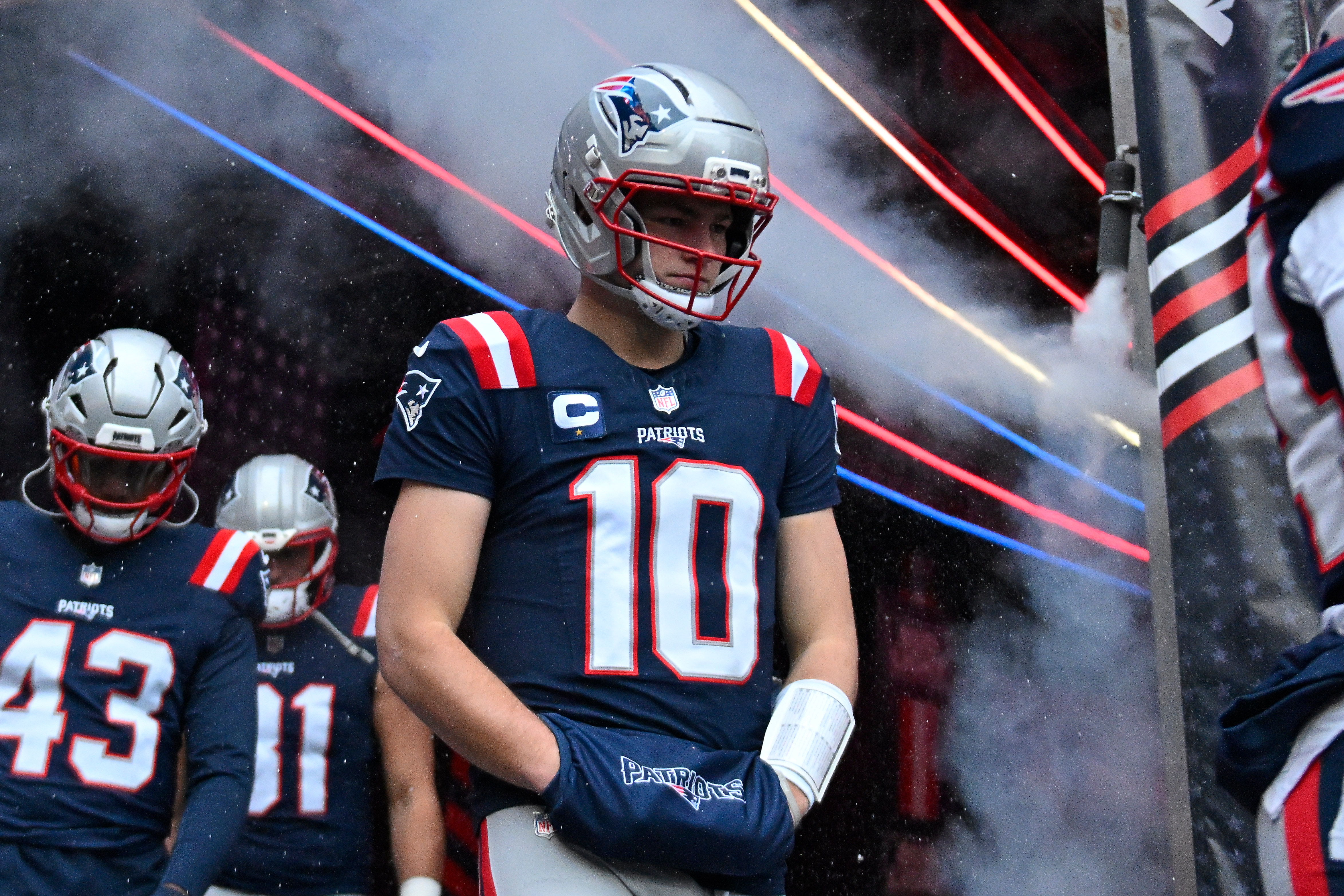  New England Patriots quarterback Drake Maye walks out of the tunnel as we look at our NFL divisional-round look-ahead odds