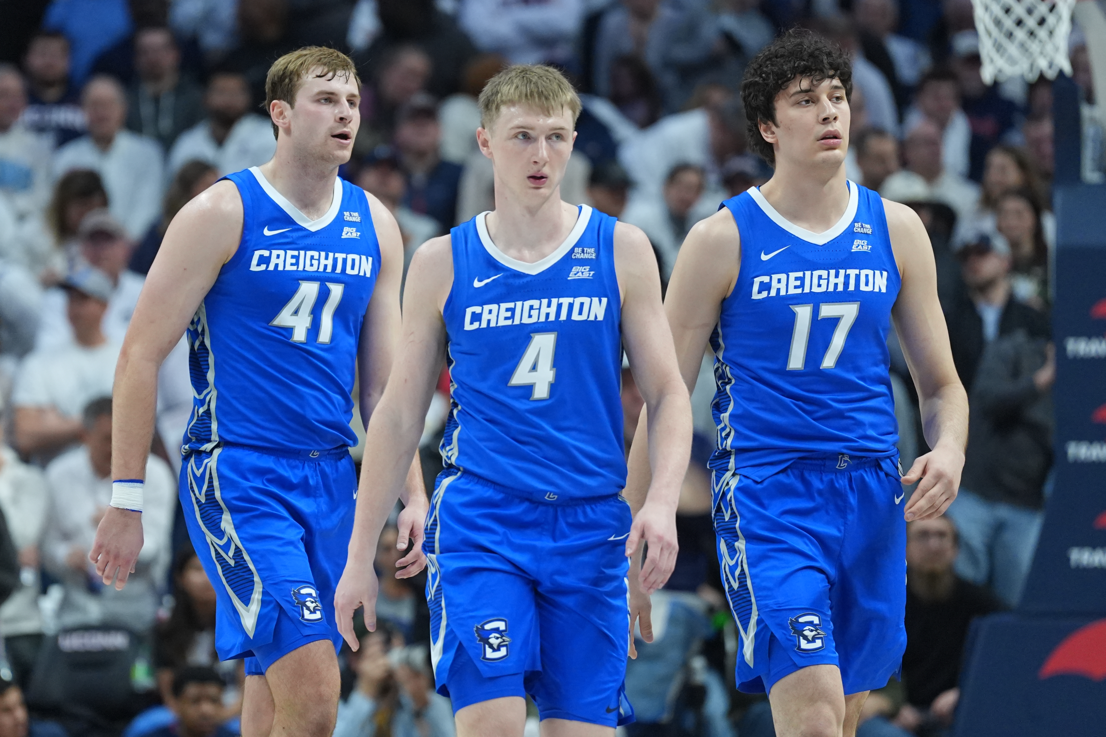 Creighton Bluejays guard Josh Dix (4), forward Isaac Traudt (41) and forward Kerem Konan (17) make their way top the bench as we break down our Rutgers vs. Creighton prediction & parlay.