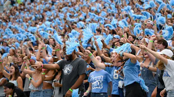 North Carolina Tar Heels fans cheer during the game against the Appalachian State Mountaineers at Kenan Memorial Stadium as we look at the betting rules in North Carolina.